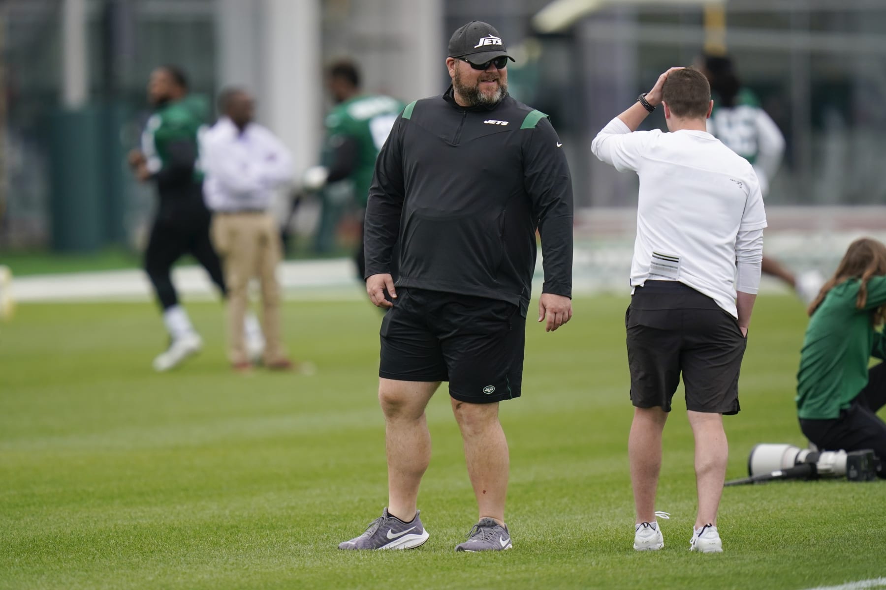 New York Jets' general manager Joe Douglas watches a practice at the NFL football team's training facility in Florham Park, N.J., Tuesday, May 24, 2022. (AP Photo/Seth Wenig)