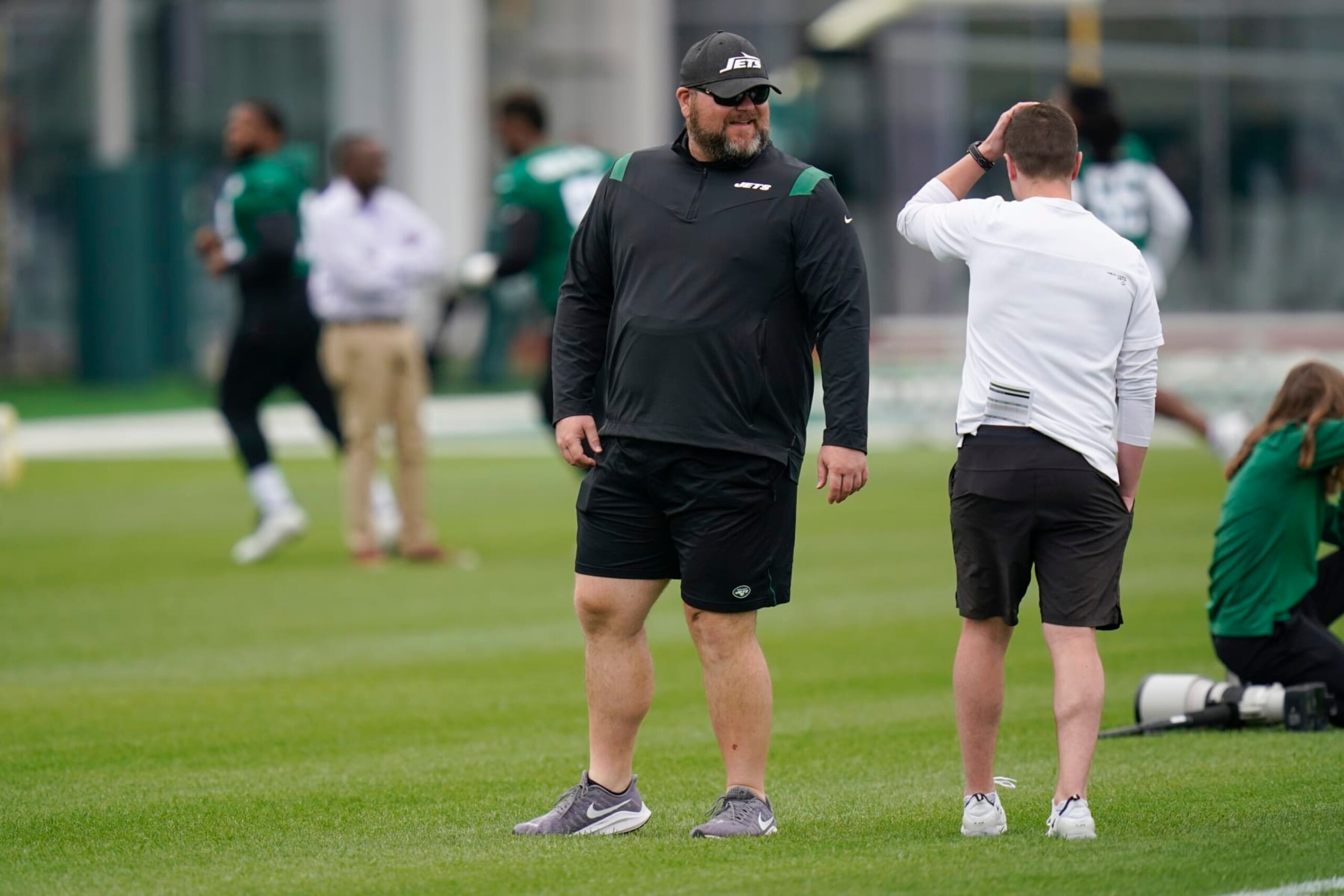 New York Jets' general manager Joe Douglas watches a practice at the NFL football team's training facility in Florham Park, N.J., Tuesday, May 24, 2022. (AP Photo/Seth Wenig)