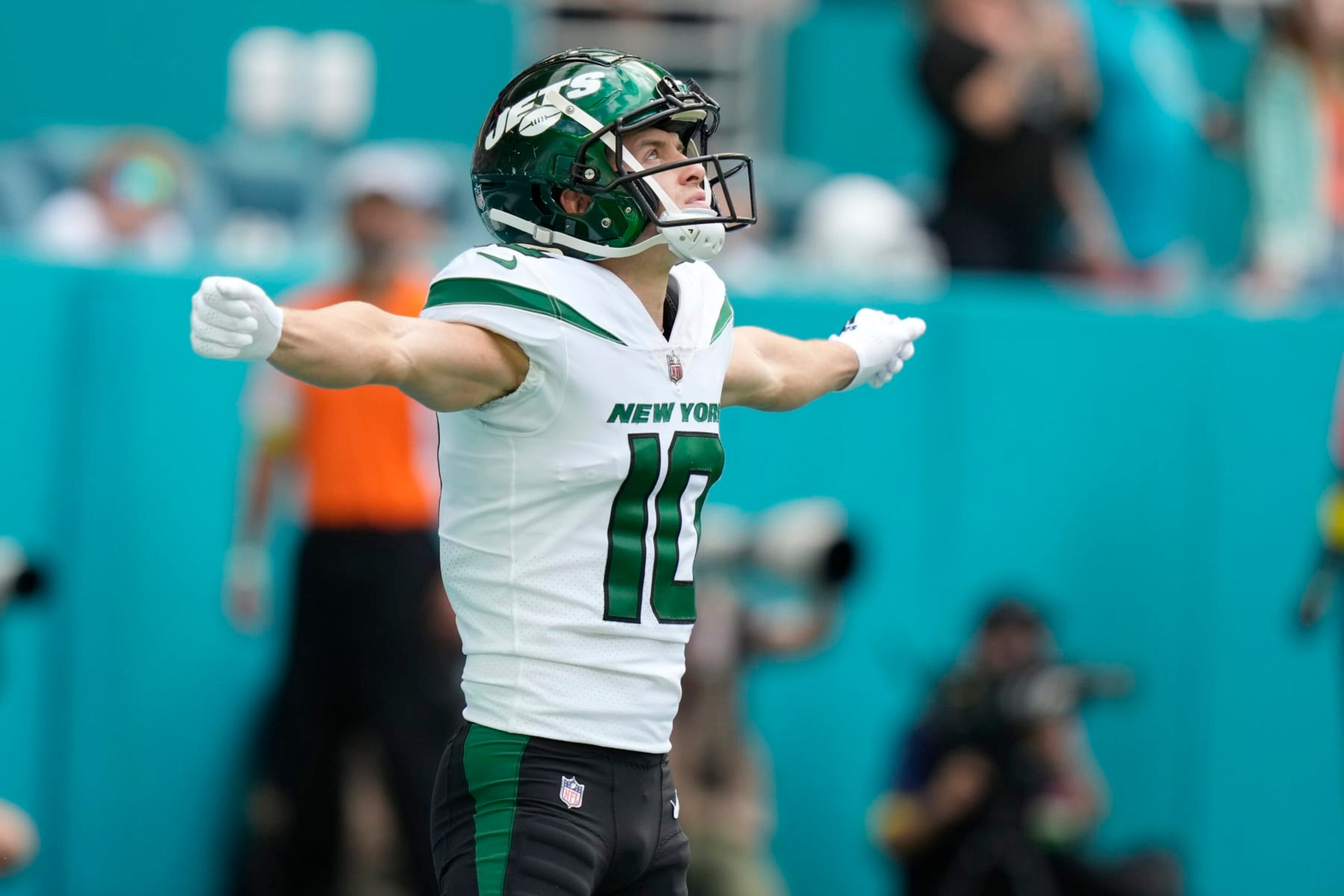 New York Jets wide receiver Braxton Berrios (10) gestures during the first half of an NFL football game against the Miami Dolphins, Sunday, Jan. 8, 2023, in Miami Gardens, Fla. (AP Photo/Lynne Sladky)