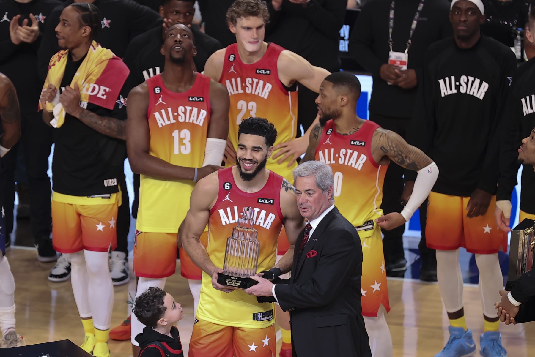 Team Giannis forward Jayson Tatum (0) receives his MVP trophy after the NBA basketball All-Star game Sunday, Feb. 19, 2023, in Salt Lake City. (AP Photo/Rob Gray)