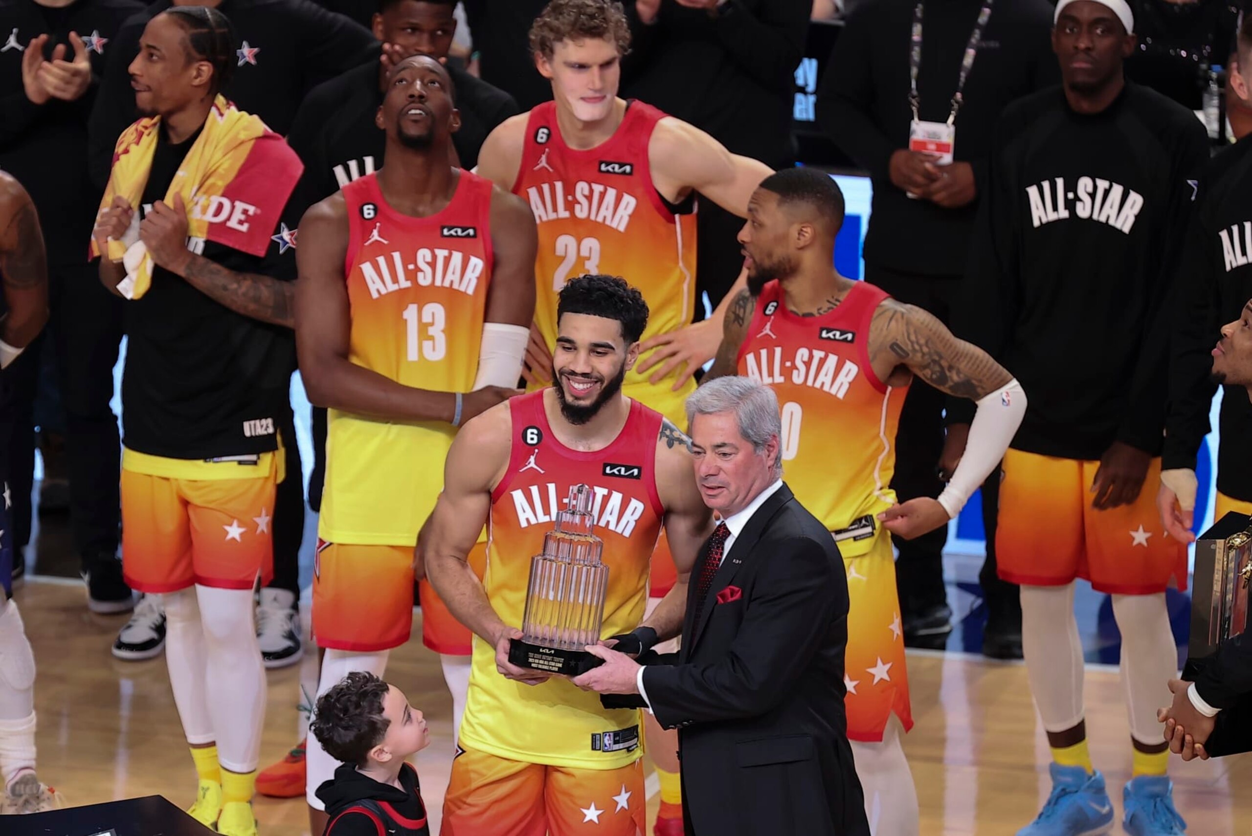 Team Giannis forward Jayson Tatum (0) receives his MVP trophy after the NBA basketball All-Star game Sunday, Feb. 19, 2023, in Salt Lake City. (AP Photo/Rob Gray)