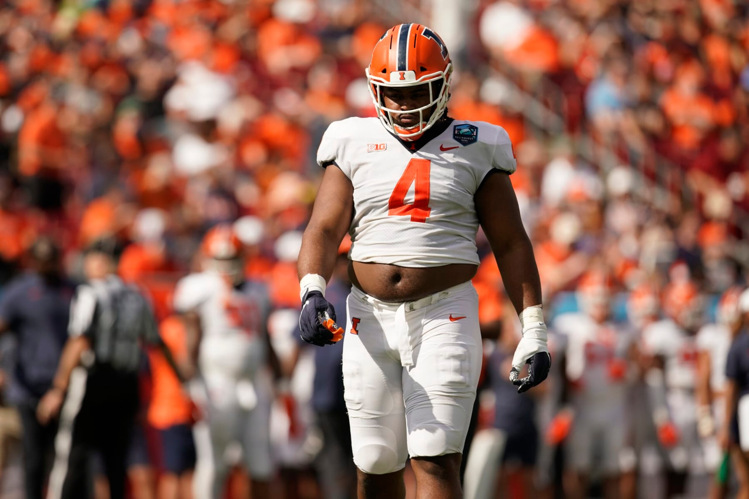 TAMPA, FL - JANUARY 02: Illinois Fighting Illini defensive lineman Jer'Zhan Newton (4) walks on the field during the ReliaQuest Bowl college football game between the Illinois Fighting Illini and the Mississippi State Bulldogs on January 02, 2023, at Raymond James Stadium in Tampa, FL. (Photo by Chris Leduc/Icon Sportswire via Getty Images) TAMPA, FL - JANUARY 02: Illinois Fighting Illini defensive lineman Jer'Zhan Newton (4) walks on the field during the ReliaQuest Bowl college football game between the Illinois Fighting Illini and the Mississippi State Bulldogs on January 02, 2023, at Raymond James Stadium in Tampa, FL. (Photo by Chris Leduc/Icon Sportswire via Getty Images)