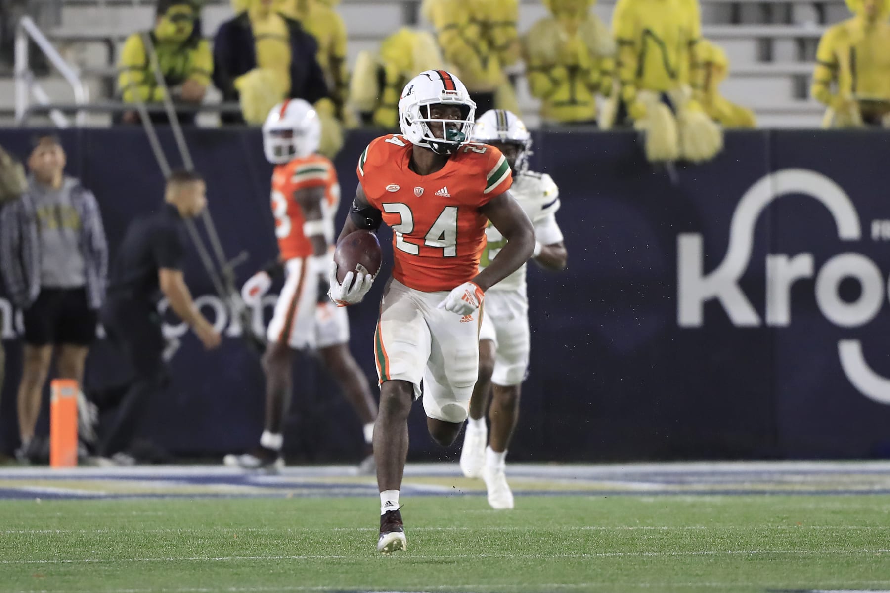 ATLANTA, GA - NOVEMBER 12: Miami Hurricanes safety Kamren Kinchens (24) runs back an interception for a touchdown during the Saturday afternoon college football game between the Miami Hurricanes and the Georgia Tech Yellow Jackets on November 12, 2022 at Bobby Dodd Stadium in Atlanta, GA.   (Photo by David J. Griffin/Icon Sportswire via Getty Images)