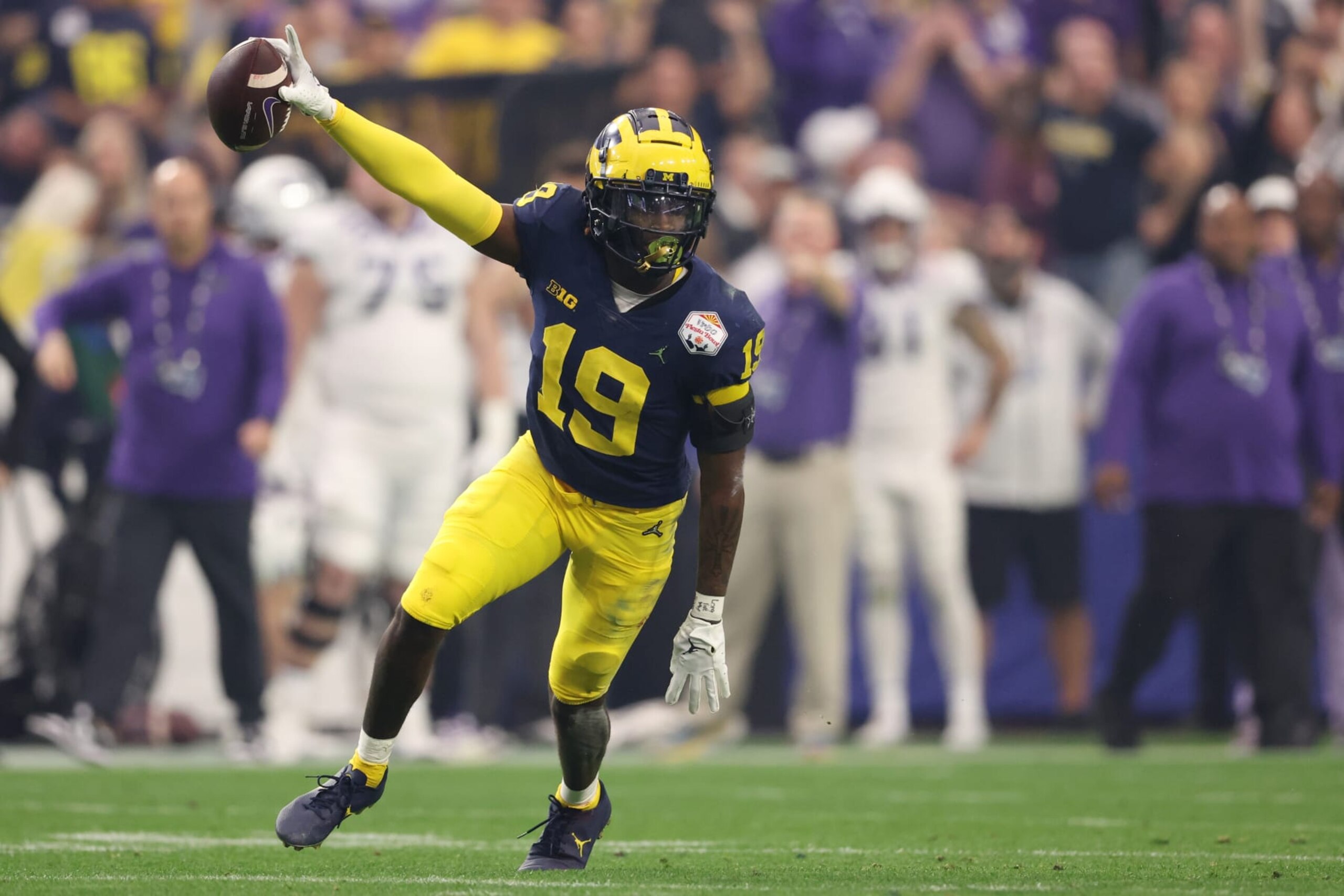 GLENDALE, ARIZONA - DECEMBER 31: Rod Moore #19 of the Michigan Wolverines celebrates after an interception during the second quarter against the TCU Horned Frogs in the Vrbo Fiesta Bowl at State Farm Stadium on December 31, 2022 in Glendale, Arizona. (Photo by Christian Petersen/Getty Images) GLENDALE, ARIZONA - DECEMBER 31: Rod Moore #19 of the Michigan Wolverines celebrates after an interception during the second quarter against the TCU Horned Frogs in the Vrbo Fiesta Bowl at State Farm Stadium on December 31, 2022 in Glendale, Arizona. (Photo by Christian Petersen/Getty Images)