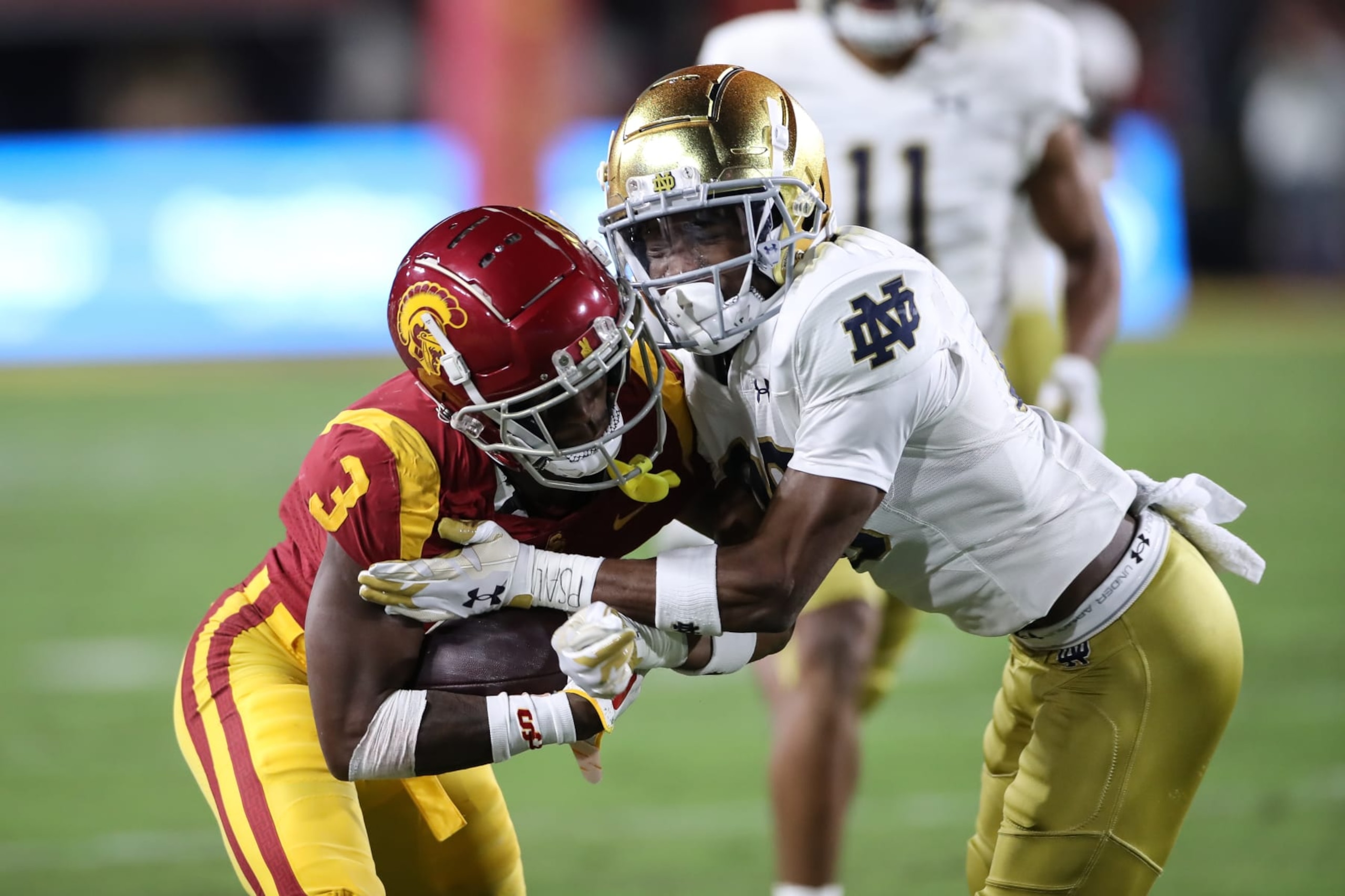 LOS ANGELES, CA - NOVEMBER 26: Notre Dame Fighting Irish cornerback Benjamin Morrison (20) hits USC Trojans wide receiver Jordan Addison (3) during Notre Dame Fighting Irish game versus USC Trojans on November 26, 2022, at the Los Angeles Memorial Coliseum in Los Angeles, CA. (Photo by Jevone Moore/Icon Sportswire via Getty Images) LOS ANGELES, CA - NOVEMBER 26: Notre Dame Fighting Irish cornerback Benjamin Morrison (20) hits USC Trojans wide receiver Jordan Addison (3) during Notre Dame Fighting Irish game versus USC Trojans on November 26, 2022, at the Los Angeles Memorial Coliseum in Los Angeles, CA. (Photo by Jevone Moore/Icon Sportswire via Getty Images)