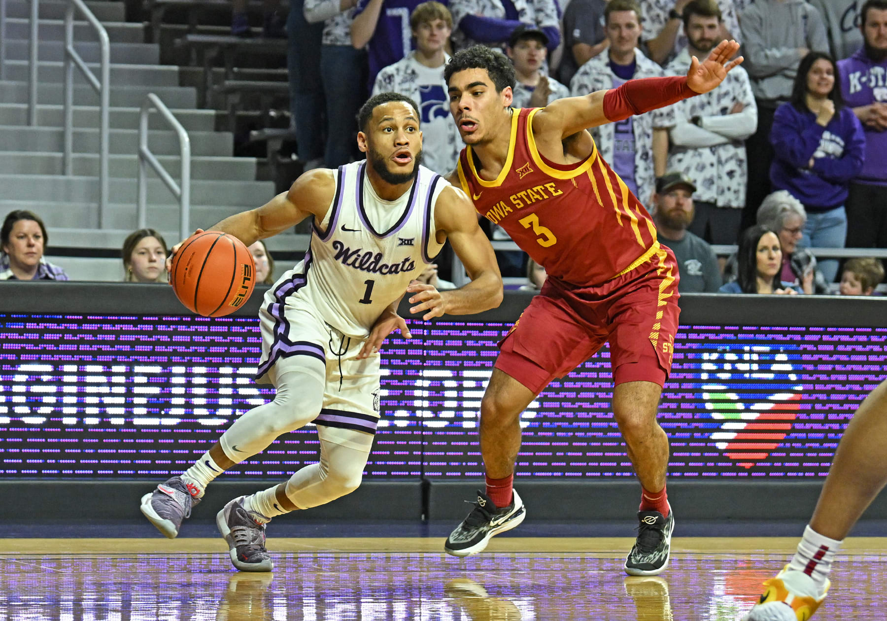MANHATTAN, KS - FEBRUARY 18:  Markquis Nowell #1 of the Kansas State Wildcats drives to the basket against Tamin Lipsey #3 of the Iowa State Cyclones during a game in the second half at Bramlage Coliseum on February 18, 2023 in Manhattan, Kansas.  (Photo by Peter G. Aiken/Getty Images)