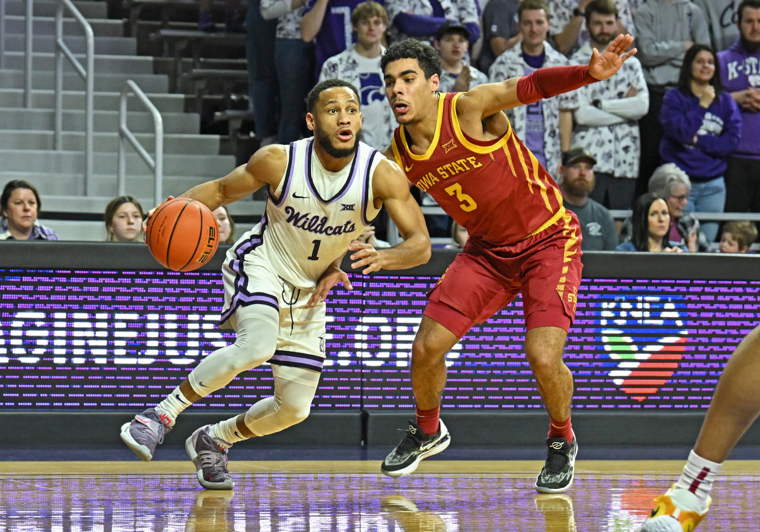 MANHATTAN, KS - FEBRUARY 18:  Markquis Nowell #1 of the Kansas State Wildcats drives to the basket against Tamin Lipsey #3 of the Iowa State Cyclones during a game in the second half at Bramlage Coliseum on February 18, 2023 in Manhattan, Kansas.  (Photo by Peter G. Aiken/Getty Images)