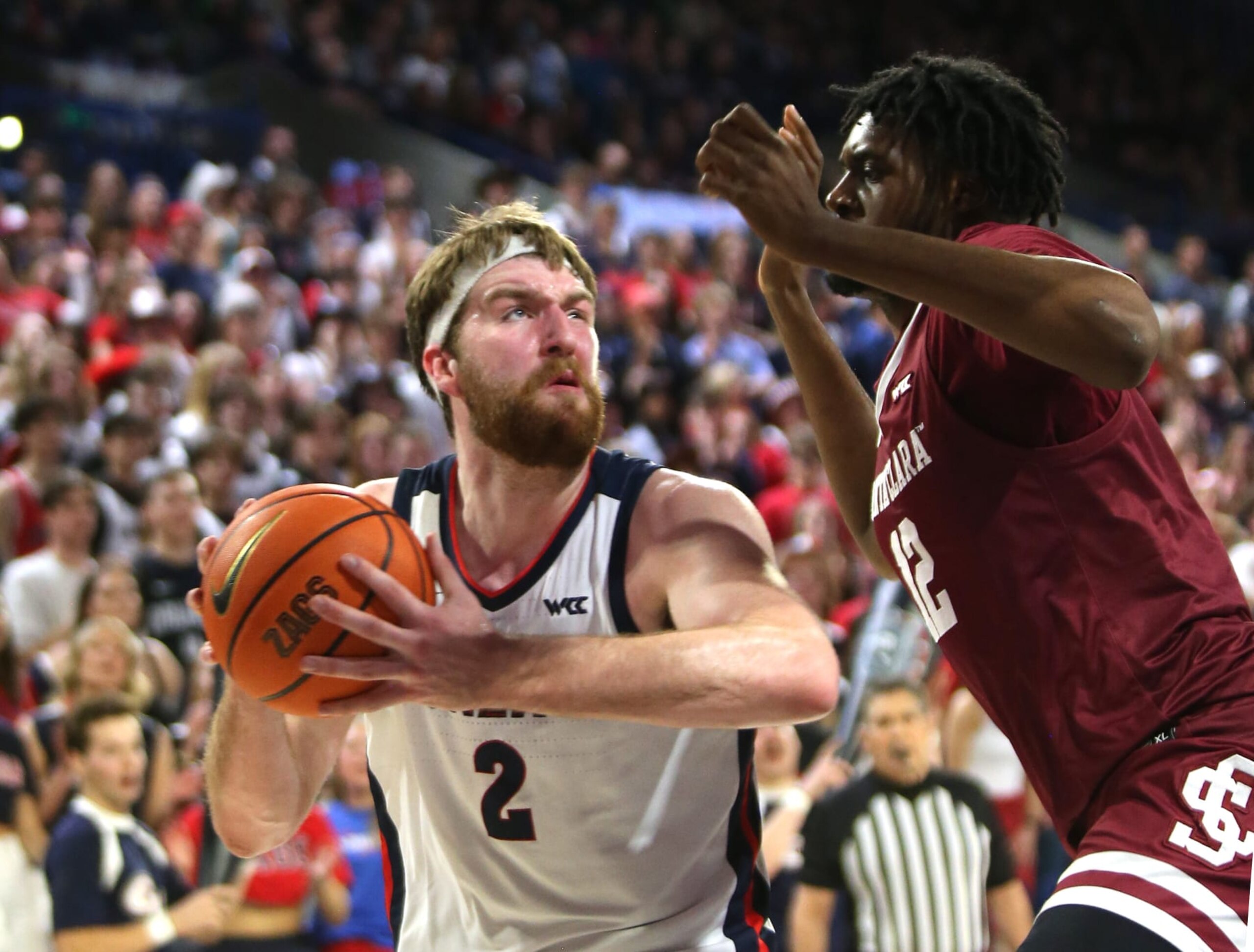 SPOKANE, WASHINGTON - FEBRUARY 02: Drew Timme #2 of the Gonzaga Bulldogs controls the ball against Jaden Bediako #12 of the Santa Clara Broncos in the first half at McCarthey Athletic Center on February 02, 2023 in Spokane, Washington. (Photo by William Mancebo/Getty Images)