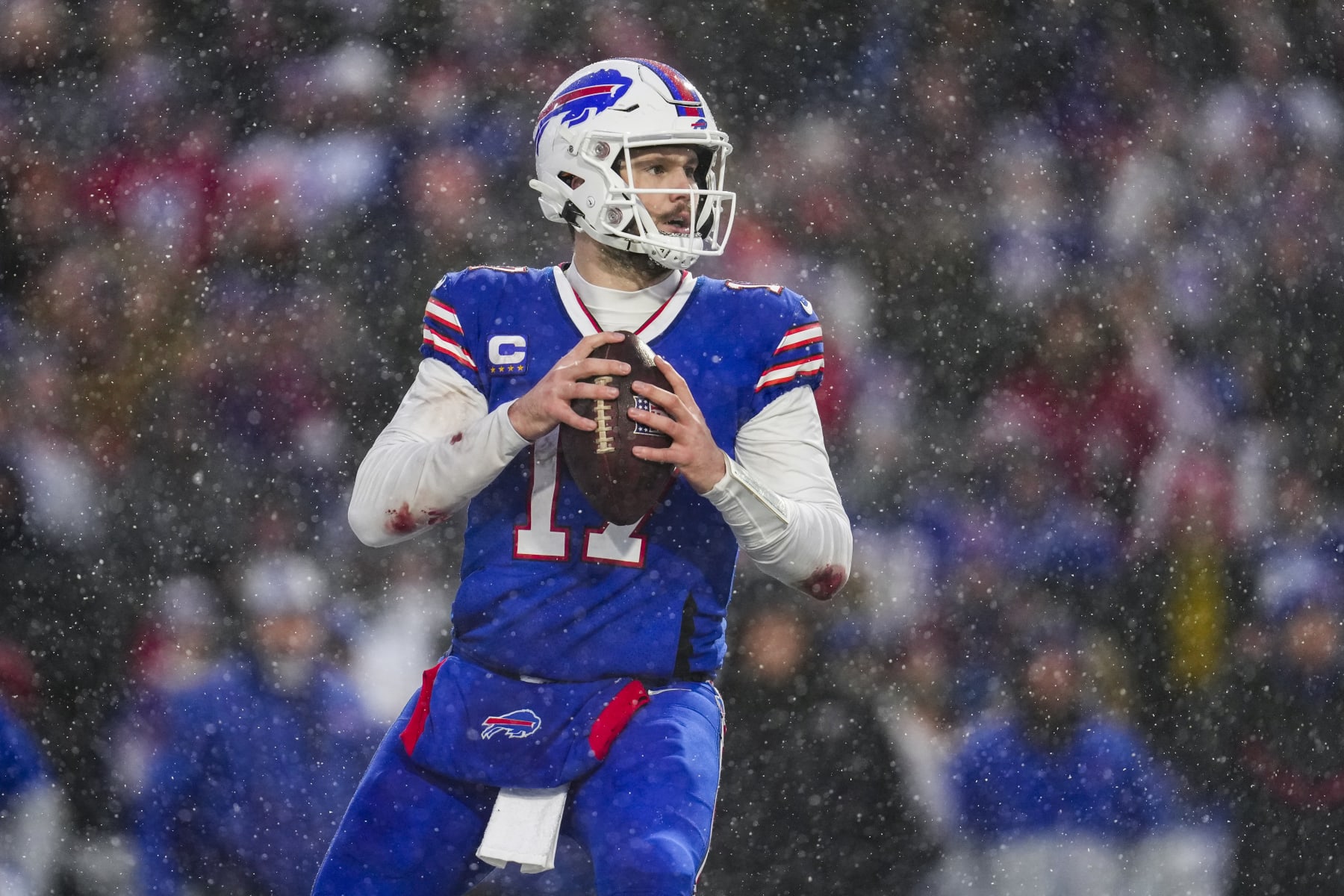 ORCHARD PARK, NY - JANUARY 22: Josh Allen #17 of the Buffalo Bills looks to pass against the Cincinnati Bengals at Highmark Stadium on January 22, 2023 in Orchard Park, New York. (Photo by Cooper Neill/Getty Images)