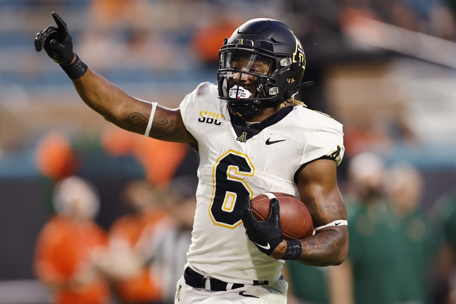 MIAMI GARDENS, FLORIDA - SEPTEMBER 11: Camerun Peoples #6 of the Appalachian State Mountaineers celebrates a 28-yard touchdown run against the Miami Hurricanes during the first quarter at Hard Rock Stadium on September 11, 2021 in Miami Gardens, Florida. (Photo by Michael Reaves/Getty Images)
