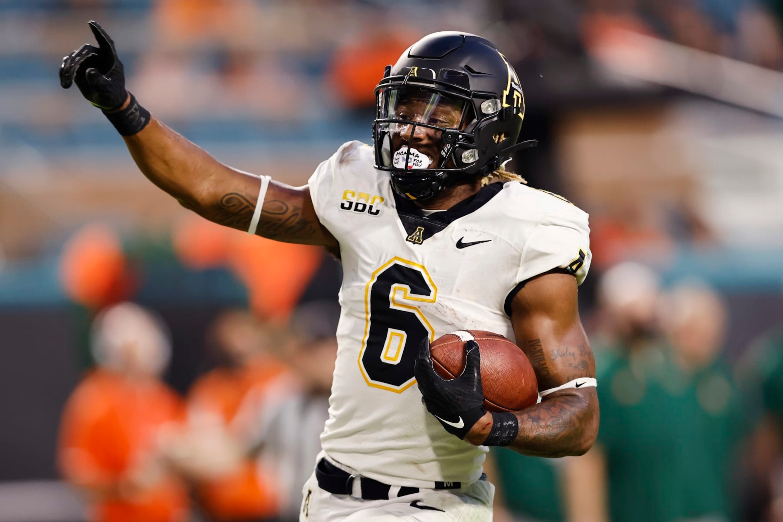 MIAMI GARDENS, FLORIDA - SEPTEMBER 11: Camerun Peoples #6 of the Appalachian State Mountaineers celebrates a 28-yard touchdown run against the Miami Hurricanes during the first quarter at Hard Rock Stadium on September 11, 2021 in Miami Gardens, Florida. (Photo by Michael Reaves/Getty Images)