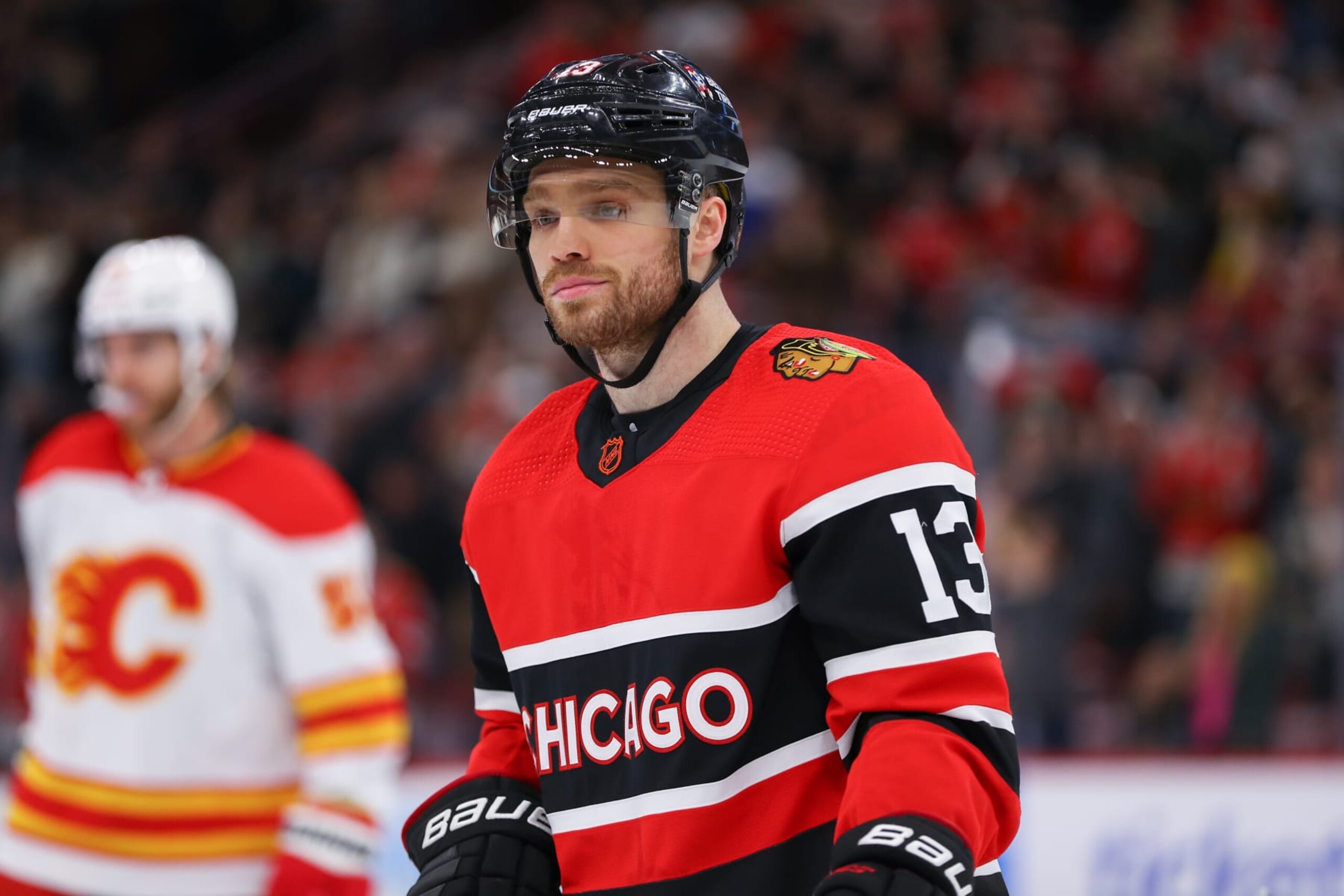 CHICAGO, IL - JANUARY 08: Chicago Blackhawks Center Max Domi (13) looks on during a game between the Calgary Flames and the Chicago Blackhawks on January 8, 2023 at the United Center in Chicago, IL. (Photo by Melissa Tamez/Icon Sportswire via Getty Images)