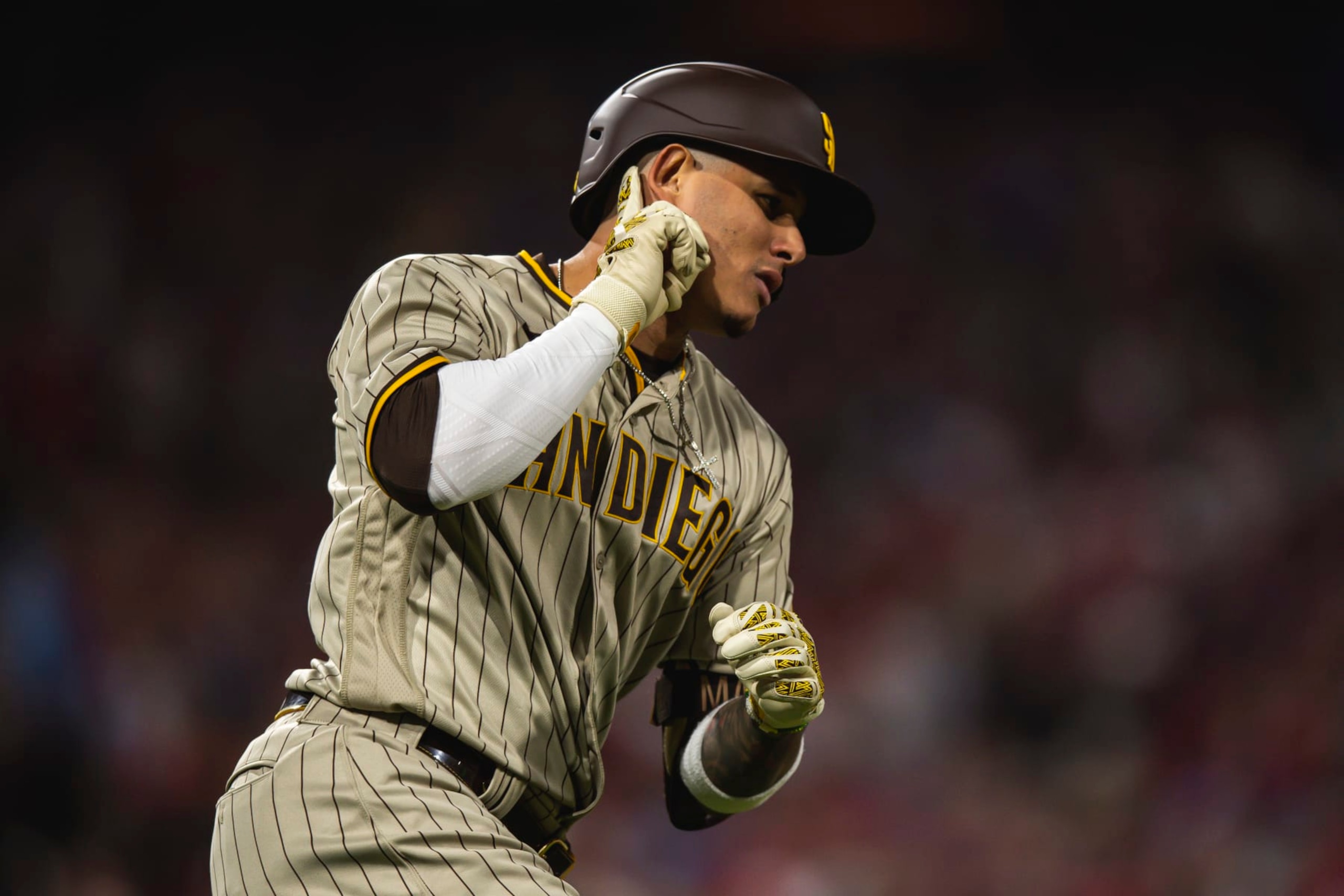 PHILADELPHIA, PENNSYLVANIA - OCTOBER 22:  Manny Machado #13 of the San Diego Padres gestures to the crowd after hitting a home run in the first inning of Game Four of the National League Championship Series against the Philadelphia Phillies at Citizens Bank Park on October 22, 2022 in Philadelphia, Pennsylvania. (Photo by Matt Thomas/San Diego Padres/Getty Images)