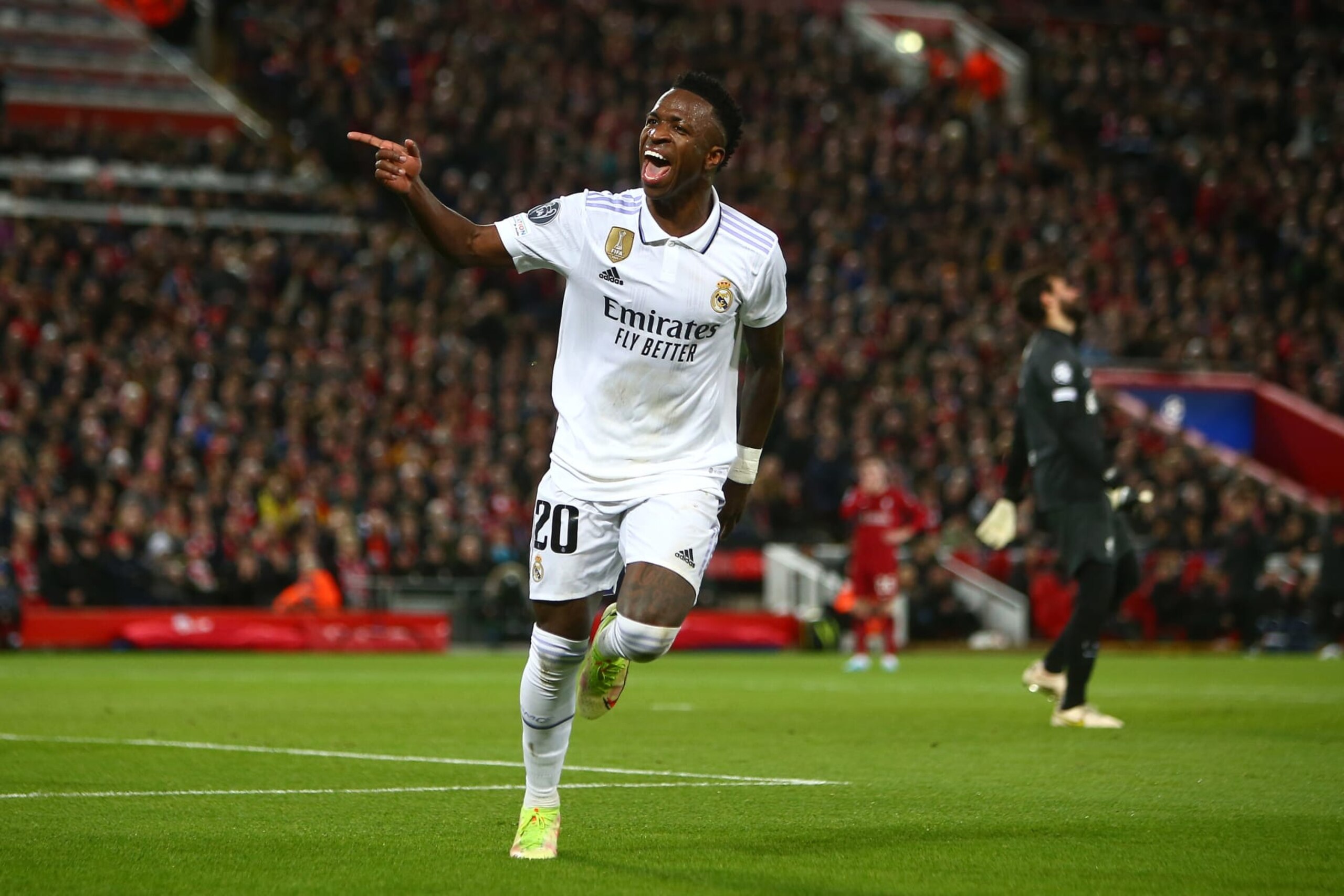LIVERPOOL, ENGLAND - FEBRUARY 21: Vinicius Junior of Real Madrid celebrates scoring his sides second goal during the UEFA Champions League round of 16 leg one match between Liverpool FC and Real Madrid at Anfield on February 21, 2023 in Liverpool, United Kingdom. (Photo by MB Media/Getty Images)