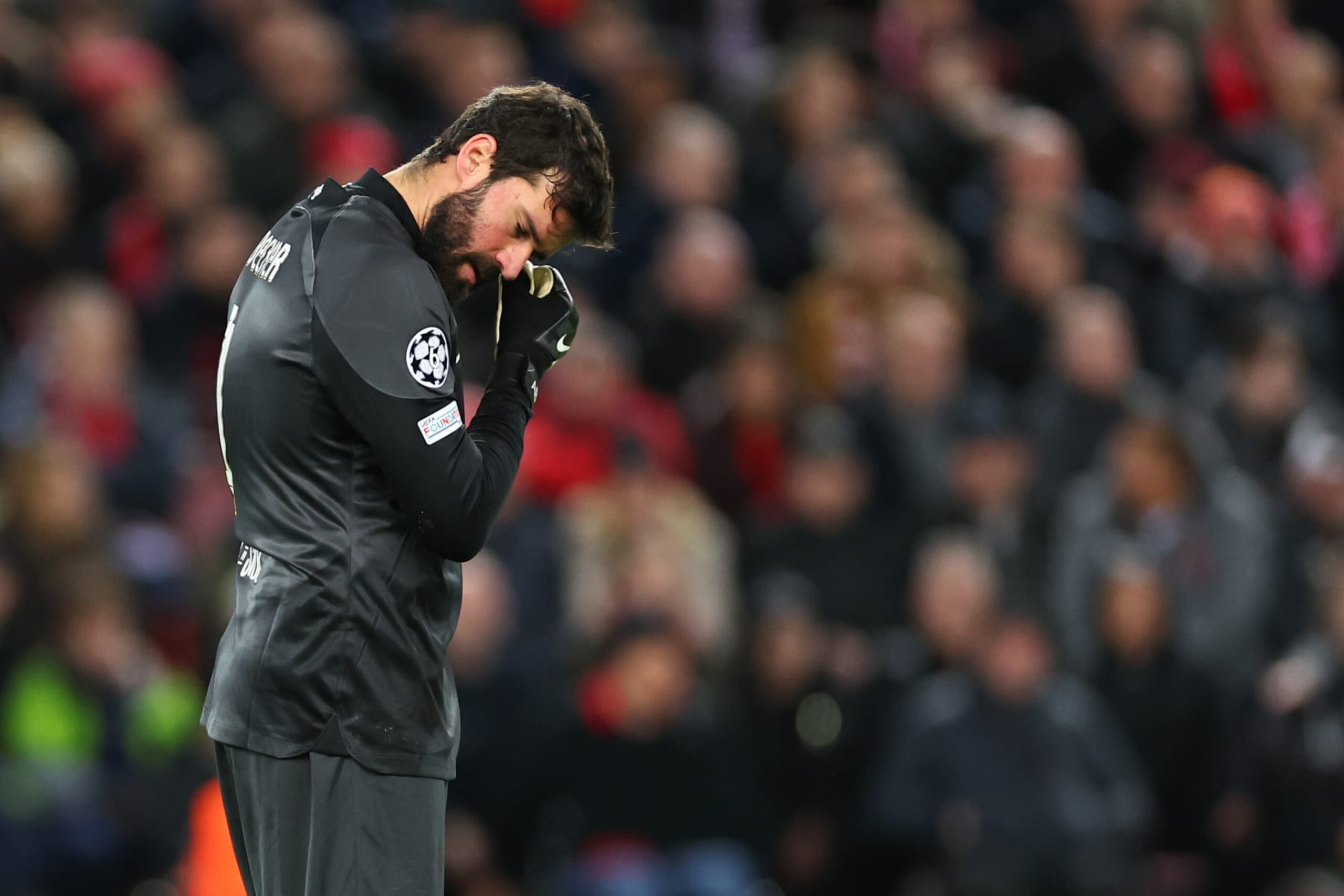 LIVERPOOL, ENGLAND - FEBRUARY 21: Alisson Becker of Liverpool reacts after a mistake which results in a goal making it 2-2 during the UEFA Champions League round of 16 leg one match between Liverpool FC and Real Madrid at Anfield on February 21, 2023 in Liverpool, United Kingdom. (Photo by Robbie Jay Barratt - AMA/Getty Images)