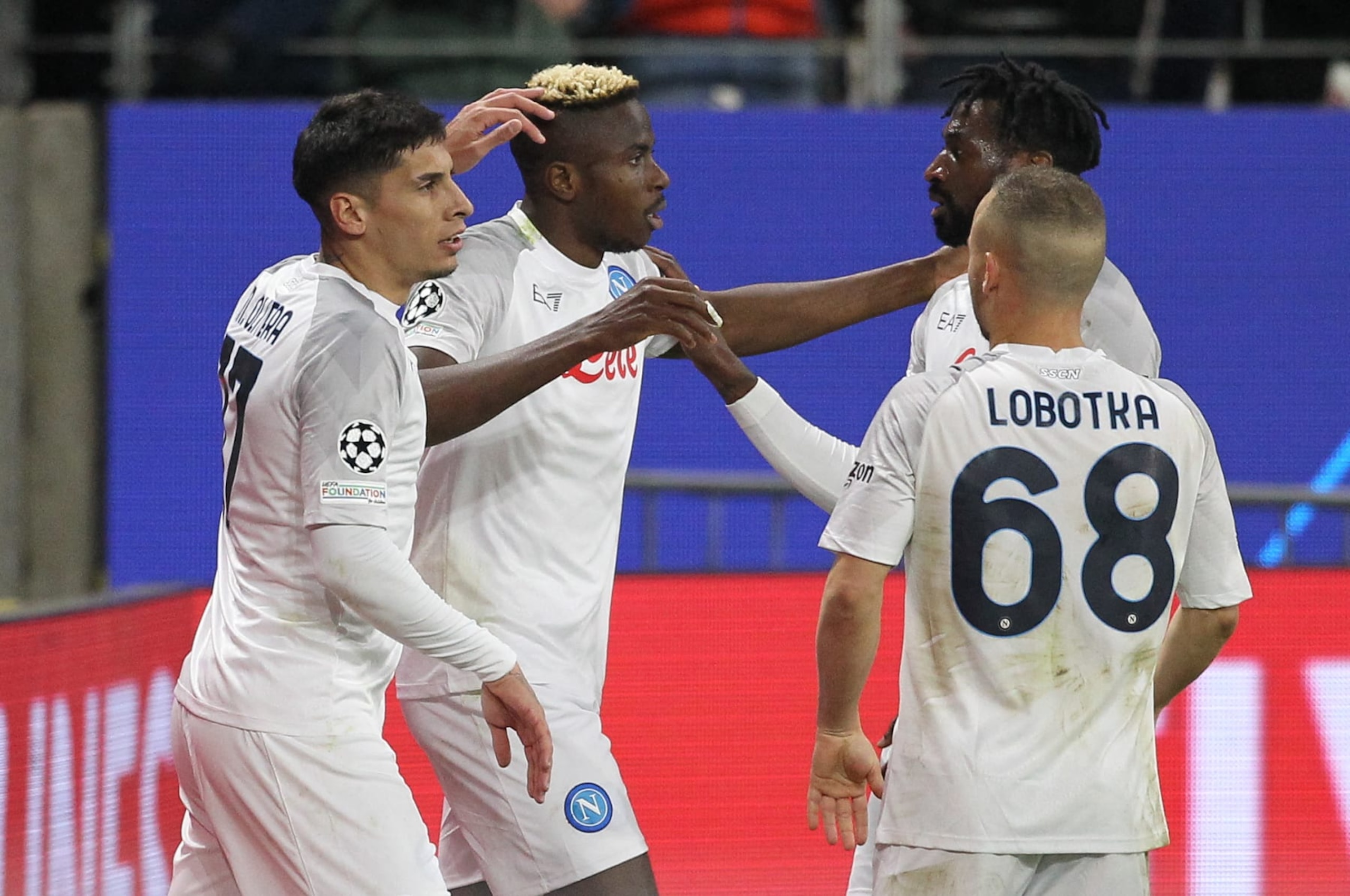 Napoli's Nigerian forward Victor Osimhen celebrates scoring the opening goal with his team mates during the UEFA Champions League round of 16 first leg football match between Eintracht Frankfurt and SSC Napoli in Frankfurt, western Germany on February 21, 2023. (Photo by Daniel ROLAND / AFP) (Photo by DANIEL ROLAND/AFP via Getty Images)