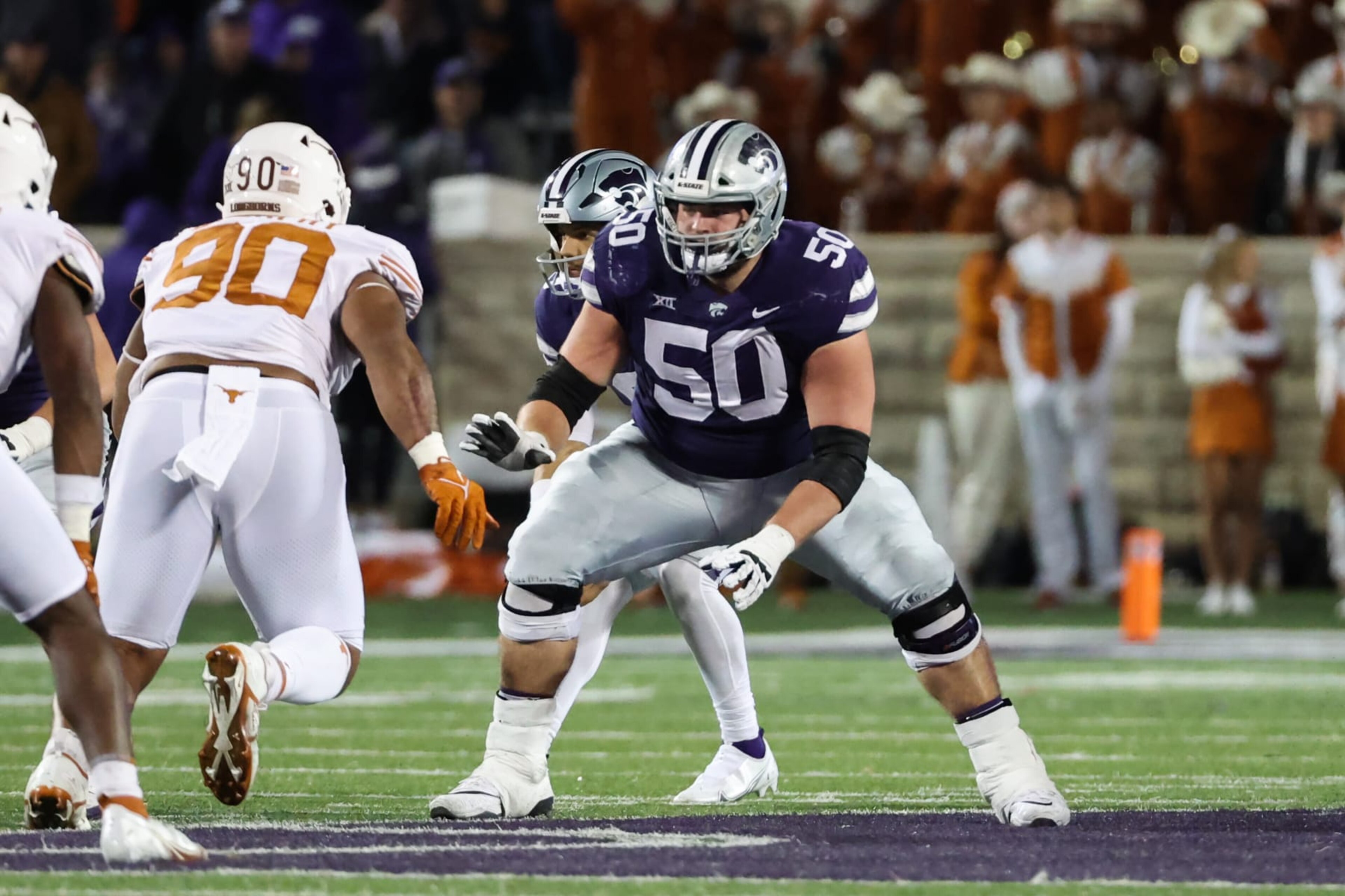 MANHATTAN, KS - NOVEMBER 05: Kansas State Wildcats offensive lineman Cooper Beebe (50) looks to block in the third quarter of a Big 12 college football game between the Texas Longhorns and Kansas State Wildcats on November 5, 2022 at Bill Snyder Family Stadium in Manhattan, KS. (Photo by Scott Winters/Icon Sportswire via Getty Images) MANHATTAN, KS - NOVEMBER 05: Kansas State Wildcats offensive lineman Cooper Beebe (50) looks to block in the third quarter of a Big 12 college football game between the Texas Longhorns and Kansas State Wildcats on November 5, 2022 at Bill Snyder Family Stadium in Manhattan, KS. (Photo by Scott Winters/Icon Sportswire via Getty Images)