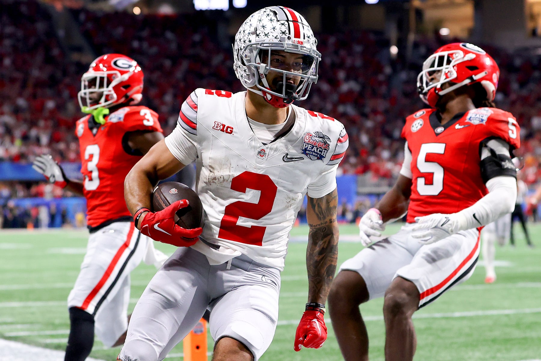 ATLANTA, GEORGIA - DECEMBER 31: Emeka Egbuka #2 of the Ohio State Buckeyes reacts after scoring a touchdown during the third quarter against the Georgia Bulldogs in the Chick-fil-A Peach Bowl at Mercedes-Benz Stadium on December 31, 2022 in Atlanta, Georgia. (Photo by Kevin C. Cox/Getty Images)