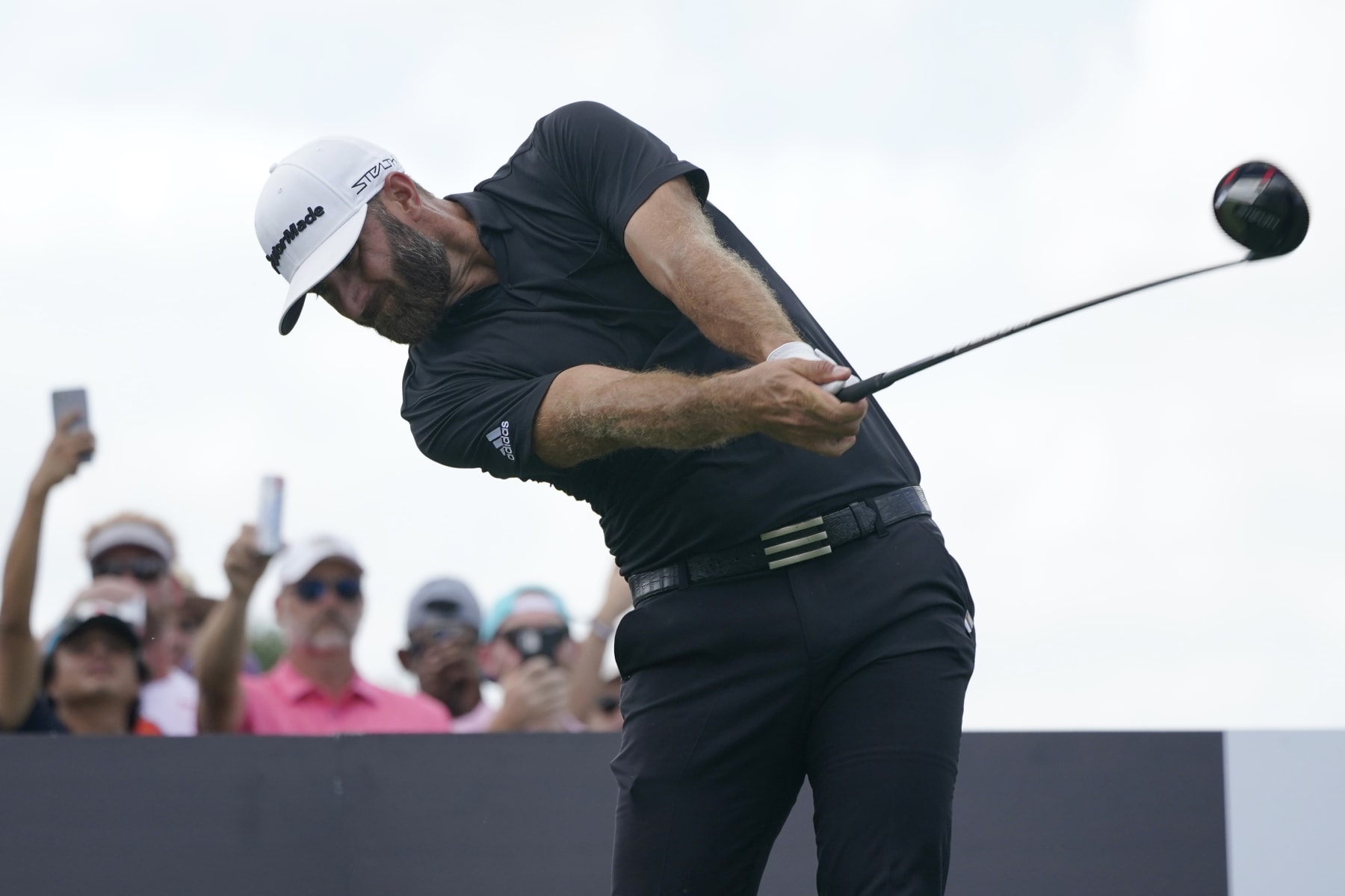 Dustin Johnson hits from the third tee during the final round of the LIV Golf Team Championship at Trump National Doral Golf Club, Sunday, Oct. 30, 2022, in Doral, Fla. (AP Photo/Lynne Sladky)