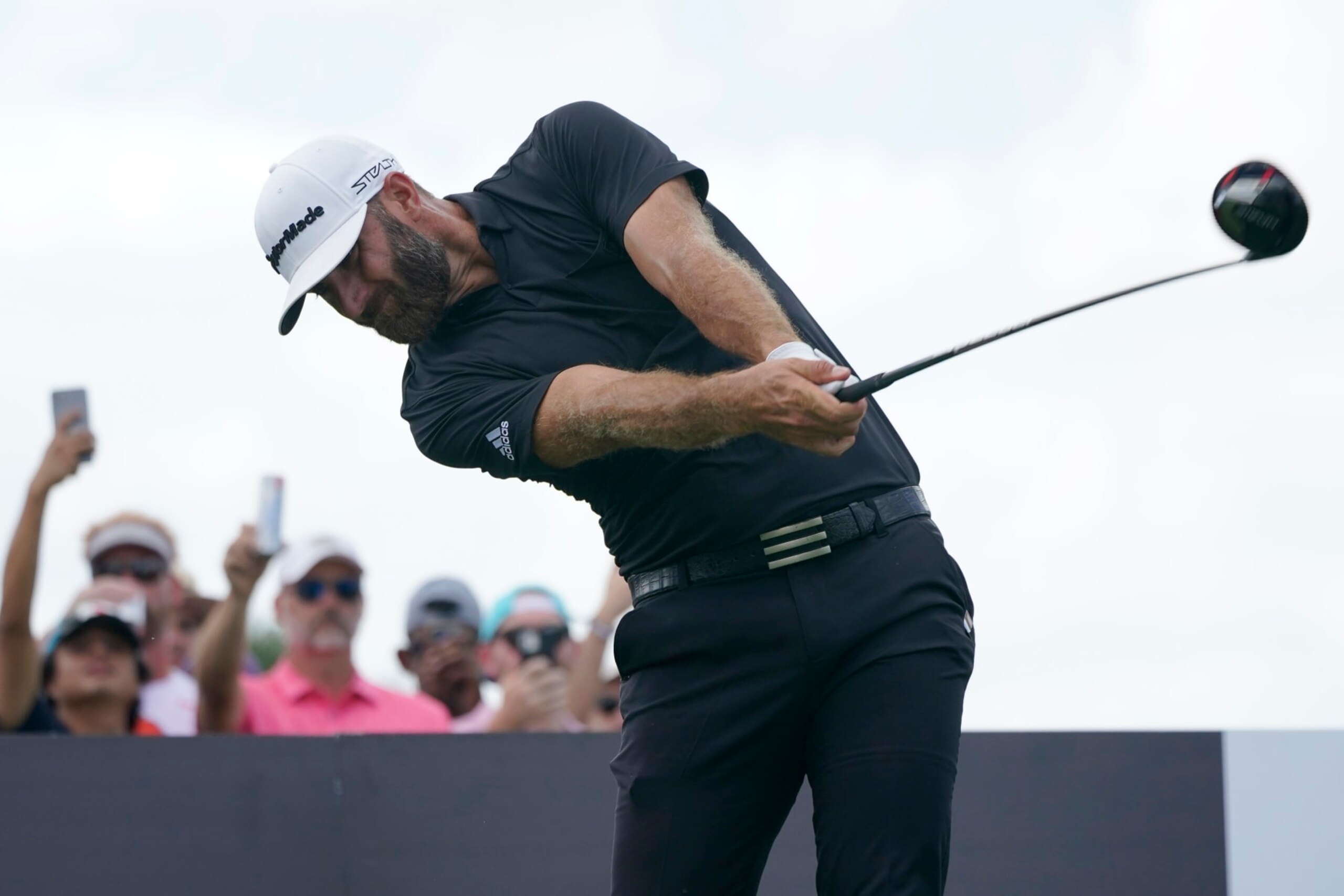 Dustin Johnson hits from the third tee during the final round of the LIV Golf Team Championship at Trump National Doral Golf Club, Sunday, Oct. 30, 2022, in Doral, Fla. (AP Photo/Lynne Sladky)