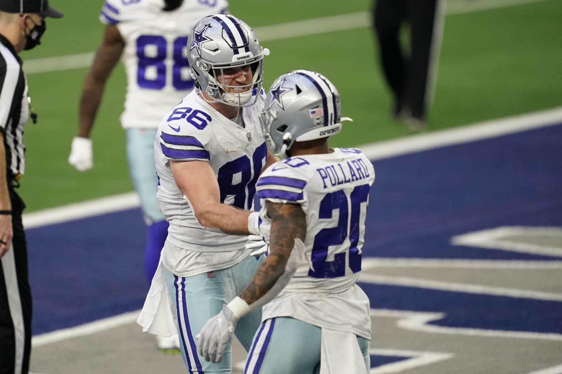 ARLINGTON, TEXAS - DECEMBER 20: Dalton Schultz #86 of the Dallas Cowboys celebrates with running back Tony Pollard (20) during an NFL game against the San Francisco 49ers on December 20, 2020 in Arlington, Texas. (Photo by Cooper Neill/Getty Images)