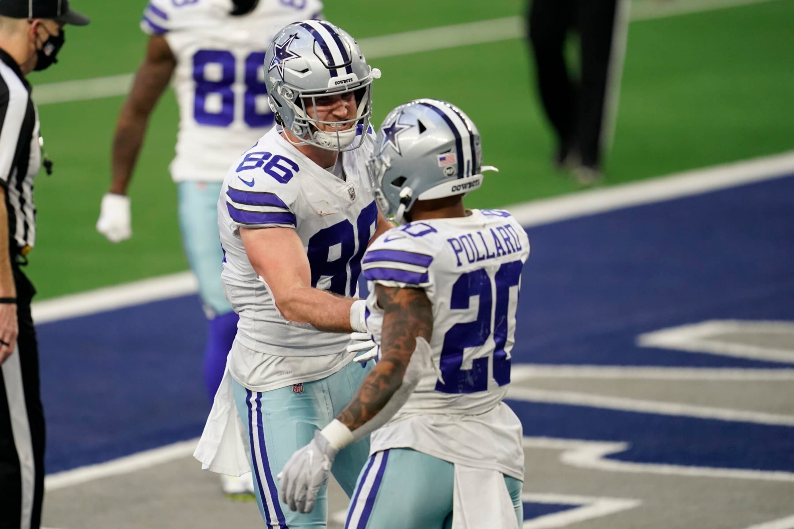ARLINGTON, TEXAS - DECEMBER 20: Dalton Schultz #86 of the Dallas Cowboys celebrates with running back Tony Pollard (20) during an NFL game against the San Francisco 49ers on December 20, 2020 in Arlington, Texas. (Photo by Cooper Neill/Getty Images)