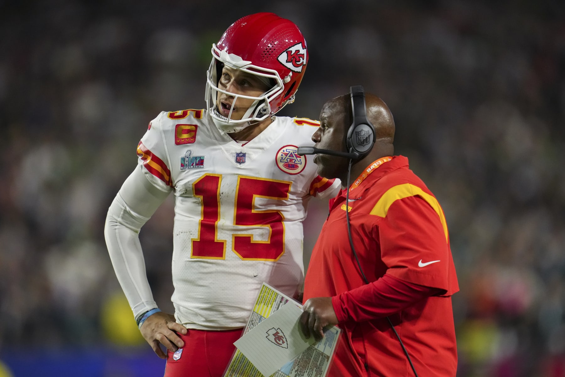 GLENDALE, AZ - FEBRUARY 12: Patrick Mahomes #15 of the Kansas City Chiefs speaks with Eric Bieniemy against the Philadelphia Eagles after Super Bowl LVII at State Farm Stadium on February 12, 2023 in Glendale, Arizona. The Chiefs defeated the Eagles 38-35. (Photo by Cooper Neill/Getty Images)
