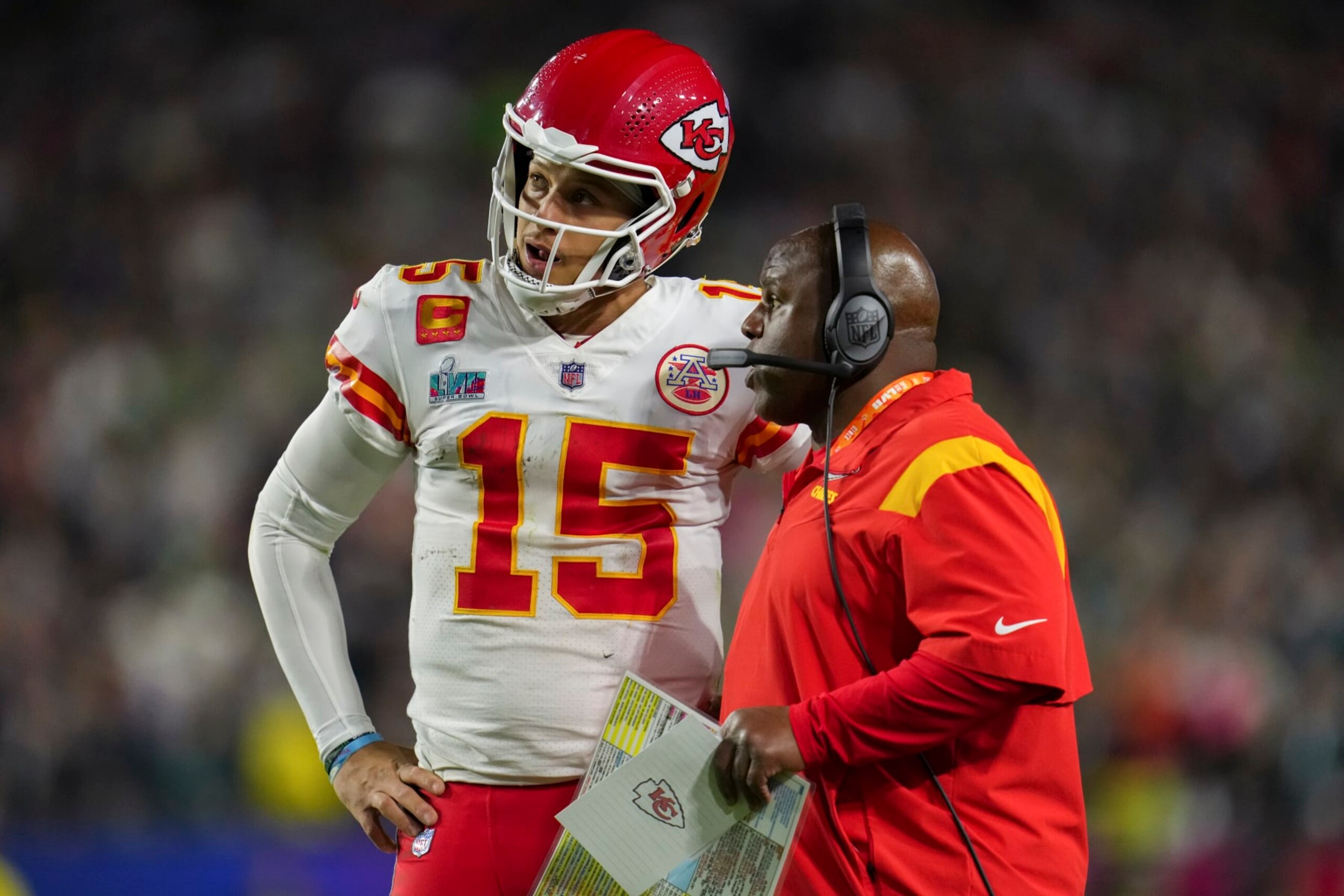 GLENDALE, AZ - FEBRUARY 12: Patrick Mahomes #15 of the Kansas City Chiefs speaks with Eric Bieniemy against the Philadelphia Eagles after Super Bowl LVII at State Farm Stadium on February 12, 2023 in Glendale, Arizona. The Chiefs defeated the Eagles 38-35. (Photo by Cooper Neill/Getty Images)