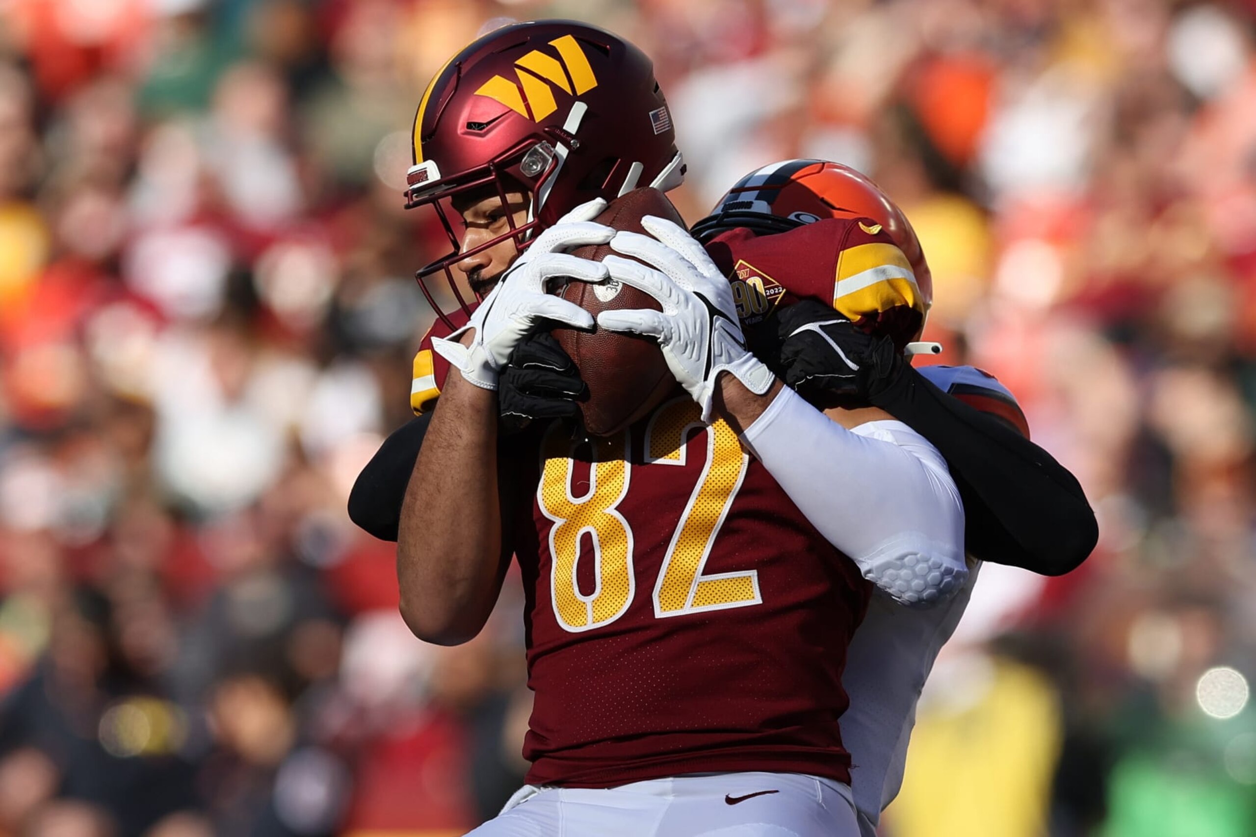 LANDOVER, MARYLAND - JANUARY 01: Logan Thomas #82 of the Washington Commanders makes a catch against D'Anthony Bell #37 of the Cleveland Browns during the first half at FedExField on January 01, 2023 in Landover, Maryland. (Photo by Todd Olszewski/Getty Images)