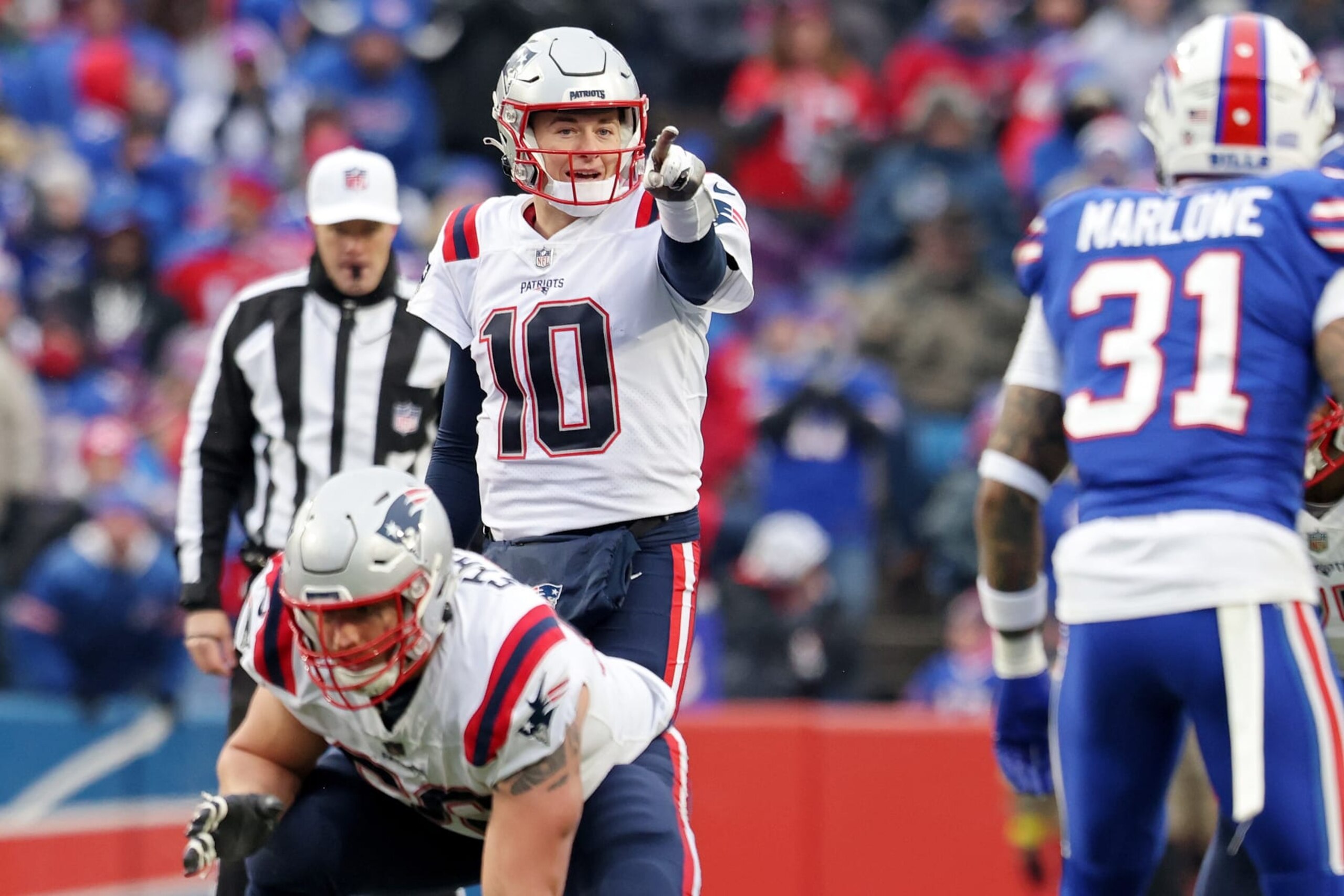 ORCHARD PARK, NEW YORK - JANUARY 08: Mac Jones #10 of the New England Patriots calls a play during the third quarter against the Buffalo Bills at Highmark Stadium on January 08, 2023 in Orchard Park, New York. (Photo by Bryan M. Bennett/Getty Images) ORCHARD PARK, NEW YORK - JANUARY 08: Mac Jones #10 of the New England Patriots calls a play during the third quarter against the Buffalo Bills at Highmark Stadium on January 08, 2023 in Orchard Park, New York. (Photo by Bryan M. Bennett/Getty Images)