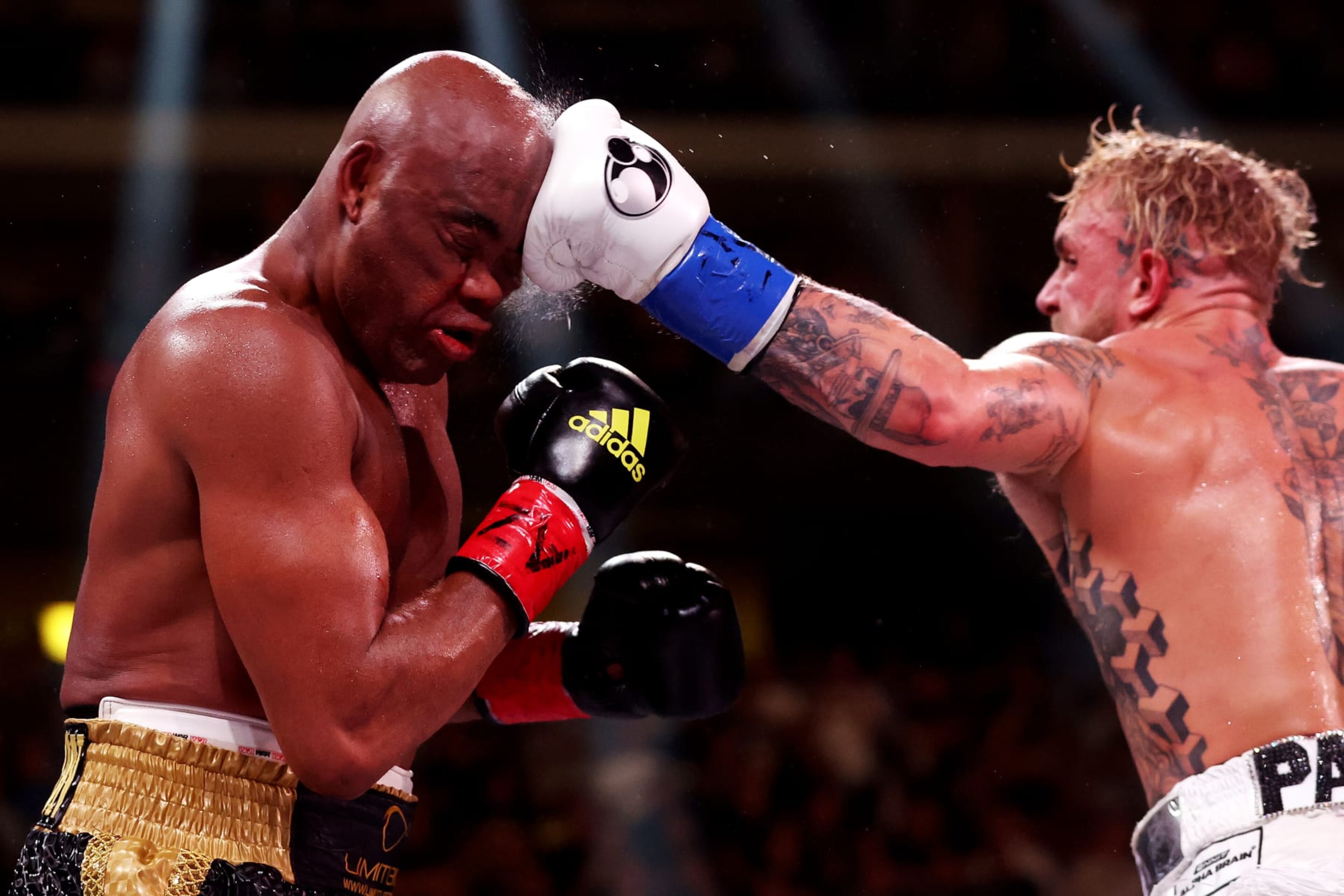 GLENDALE, ARIZONA - OCTOBER 29: Jake Paul (R) punches Anderson Silva of Brazil during their cruiserweight bout at Desert Diamond Arena on October 29, 2022 in Glendale, Arizona. (Photo by Christian Petersen/Getty Images)