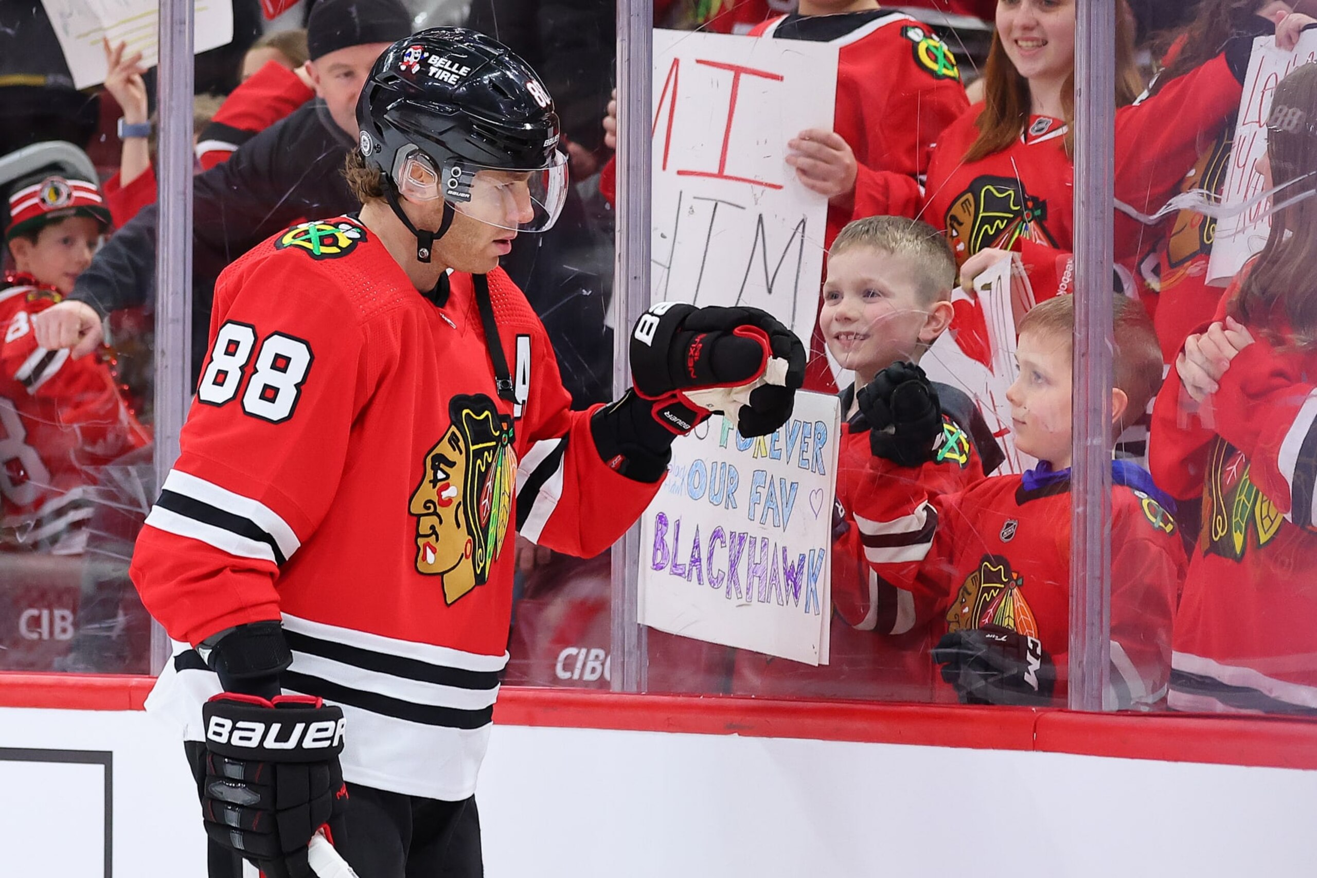 CHICAGO, ILLINOIS - FEBRUARY 21: Patrick Kane #88 of the Chicago Blackhawks fist bumps a young fan prior to the game against the Vegas Golden Knights at United Center on February 21, 2023 in Chicago, Illinois. (Photo by Michael Reaves/Getty Images) CHICAGO, ILLINOIS - FEBRUARY 21: Patrick Kane #88 of the Chicago Blackhawks fist bumps a young fan prior to the game against the Vegas Golden Knights at United Center on February 21, 2023 in Chicago, Illinois. (Photo by Michael Reaves/Getty Images)
