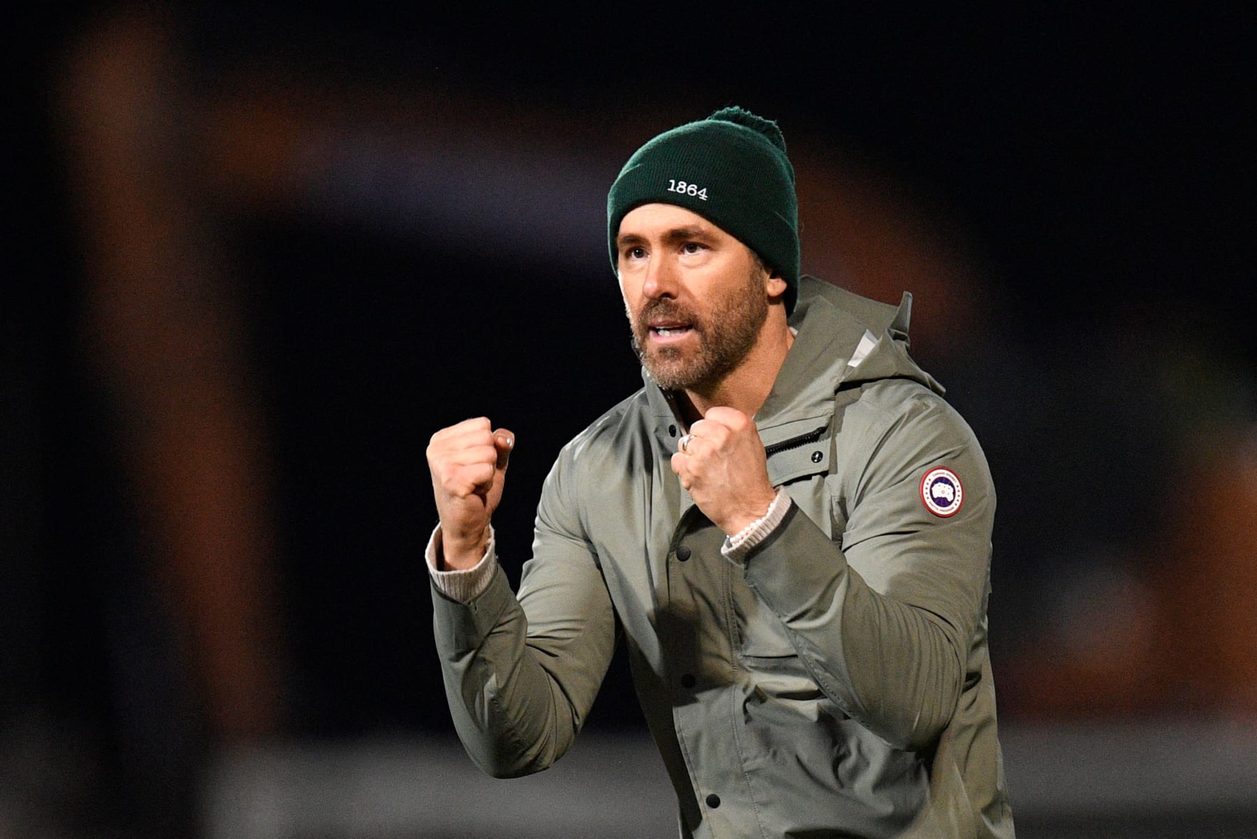 US actor and Wrexham owner Ryan Reynolds acknowledges the fans after the English FA Cup fourth round football match between Wrexham and Sheffield United at the Racecourse Ground Stadium in Wrexham, north Wales, on January 29, 2023. - The match ended in a draw at 3-3. - RESTRICTED TO EDITORIAL USE. No use with unauthorized audio, video, data, fixture lists, club/league logos or 'live' services. Online in-match use limited to 120 images. An additional 40 images may be used in extra time. No video emulation. Social media in-match use limited to 120 images. An additional 40 images may be used in extra time. No use in betting publications, games or single club/league/player publications. (Photo by Oli SCARFF / AFP) / RESTRICTED TO EDITORIAL USE. No use with unauthorized audio, video, data, fixture lists, club/league logos or 'live' services. Online in-match use limited to 120 images. An additional 40 images may be used in extra time. No video emulation. Social media in-match use limited to 120 images. An additional 40 images may be used in extra time. No use in betting publications, games or single club/league/player publications. / RESTRICTED TO EDITORIAL USE. No use with unauthorized audio, video, data, fixture lists, club/league logos or 'live' services. Online in-match use limited to 120 images. An additional 40 images may be used in extra time. No video emulation. Social media in-match use limited to 120 images. An additional 40 images may be used in extra time. No use in betting publications, games or single club/league/player publications. (Photo by OLI SCARFF/AFP via Getty Images)