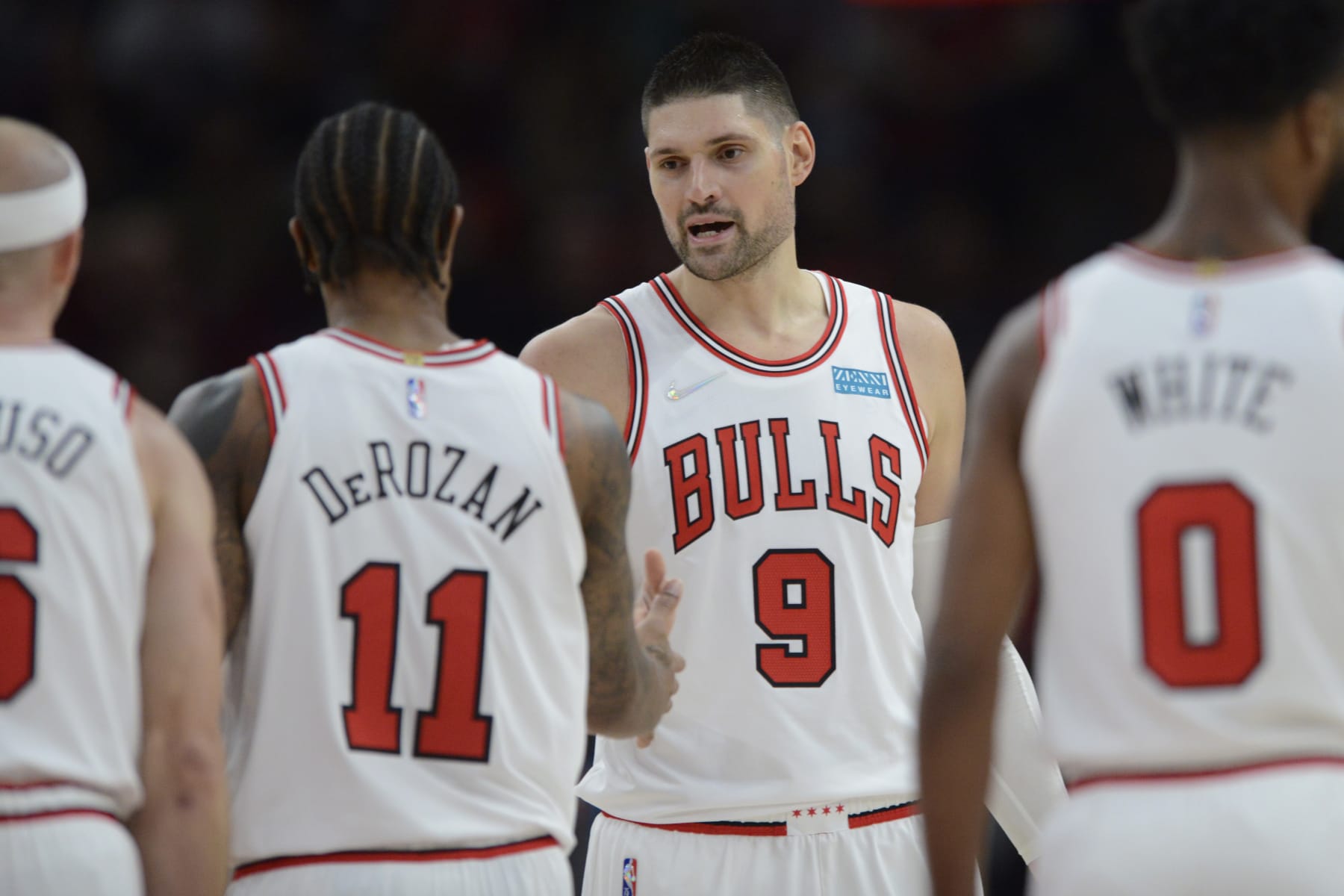 Chicago Bulls' Nikola Vucevic (9) and DeMar DeRozan (11) celebrate during the second half of a NBA basketball game against the Charlotte Hornets Monday, Nov. 29, 2021 in Chicago. Chicago won 133-119. (AP Photo/Paul Beaty)