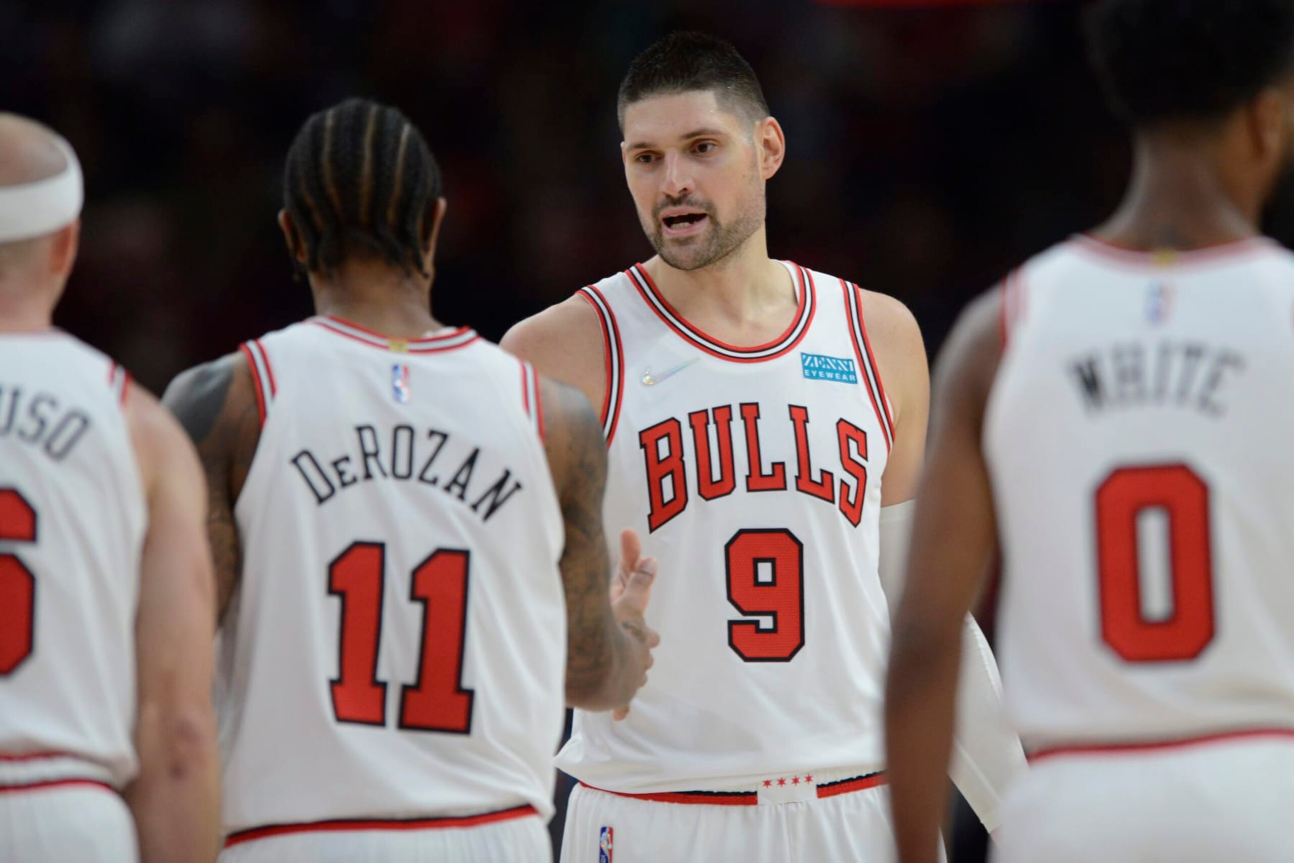 Chicago Bulls' Nikola Vucevic (9) and DeMar DeRozan (11) celebrate during the second half of a NBA basketball game against the Charlotte Hornets Monday, Nov. 29, 2021 in Chicago. Chicago won 133-119. (AP Photo/Paul Beaty)