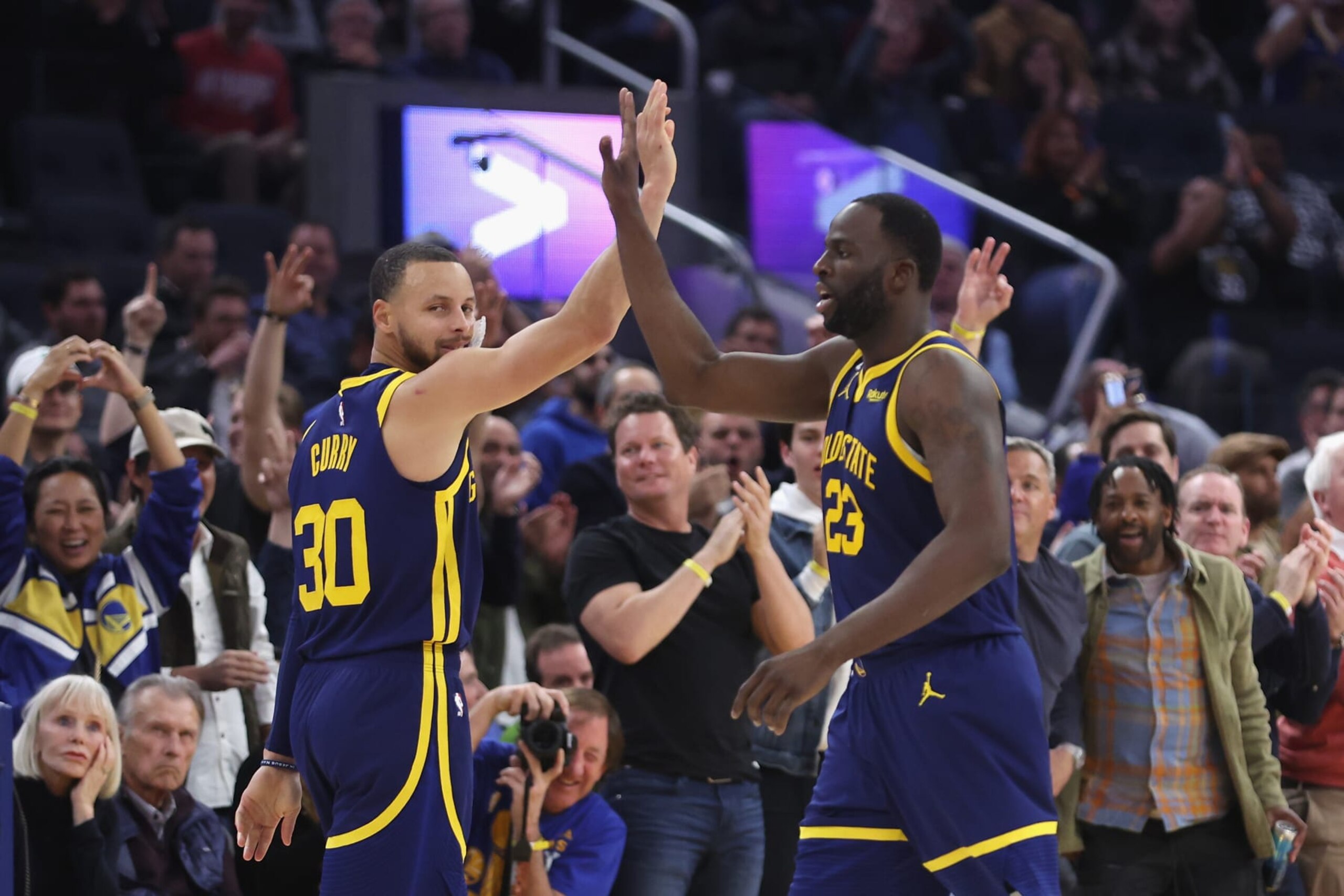 Stephen Curry and Draymond Green. Stephen Curry and Draymond Green.
