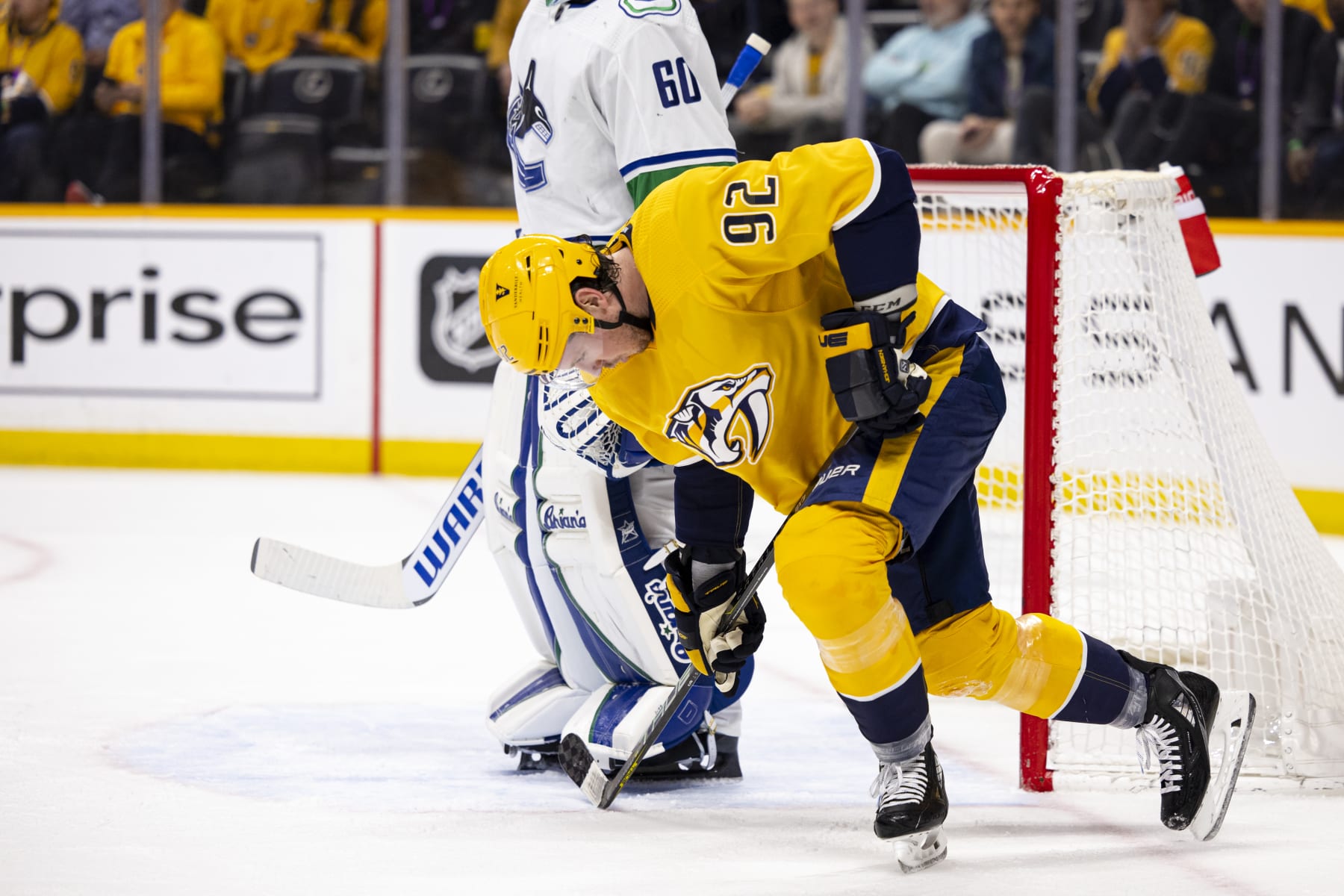 NASHVILLE, TN - FEBRUARY 21: Ryan Johansen #92 of the Nashville Predators struggles to his feet as he skates to the bench after an injury during the first period of the game against the Vancouver Canucks at Bridgestone Arena on February 21, 2023 in Nashville, Tennessee. (Photo by Brett Carlsen/Getty Images)