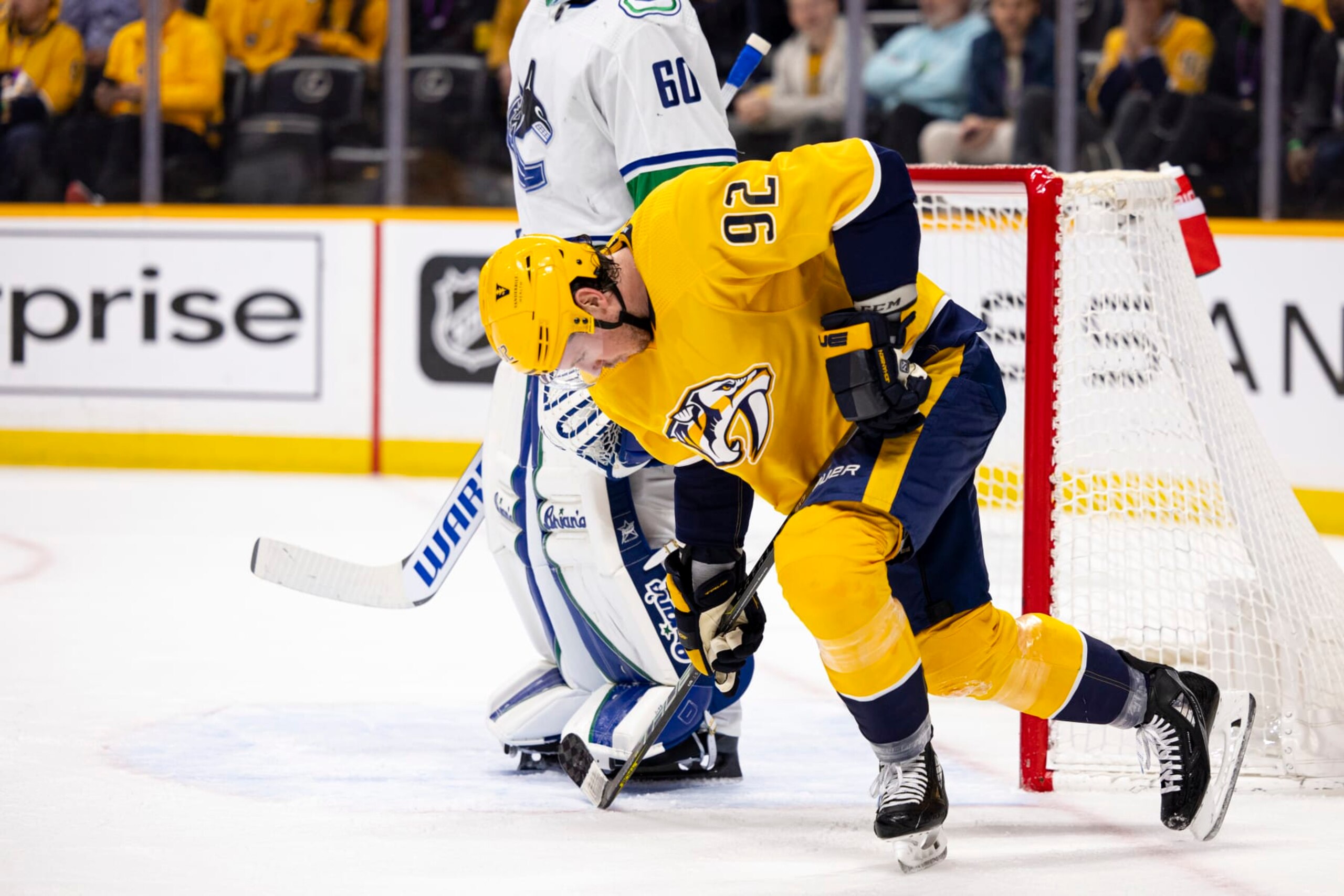 NASHVILLE, TN - FEBRUARY 21: Ryan Johansen #92 of the Nashville Predators struggles to his feet as he skates to the bench after an injury during the first period of the game against the Vancouver Canucks at Bridgestone Arena on February 21, 2023 in Nashville, Tennessee. (Photo by Brett Carlsen/Getty Images)