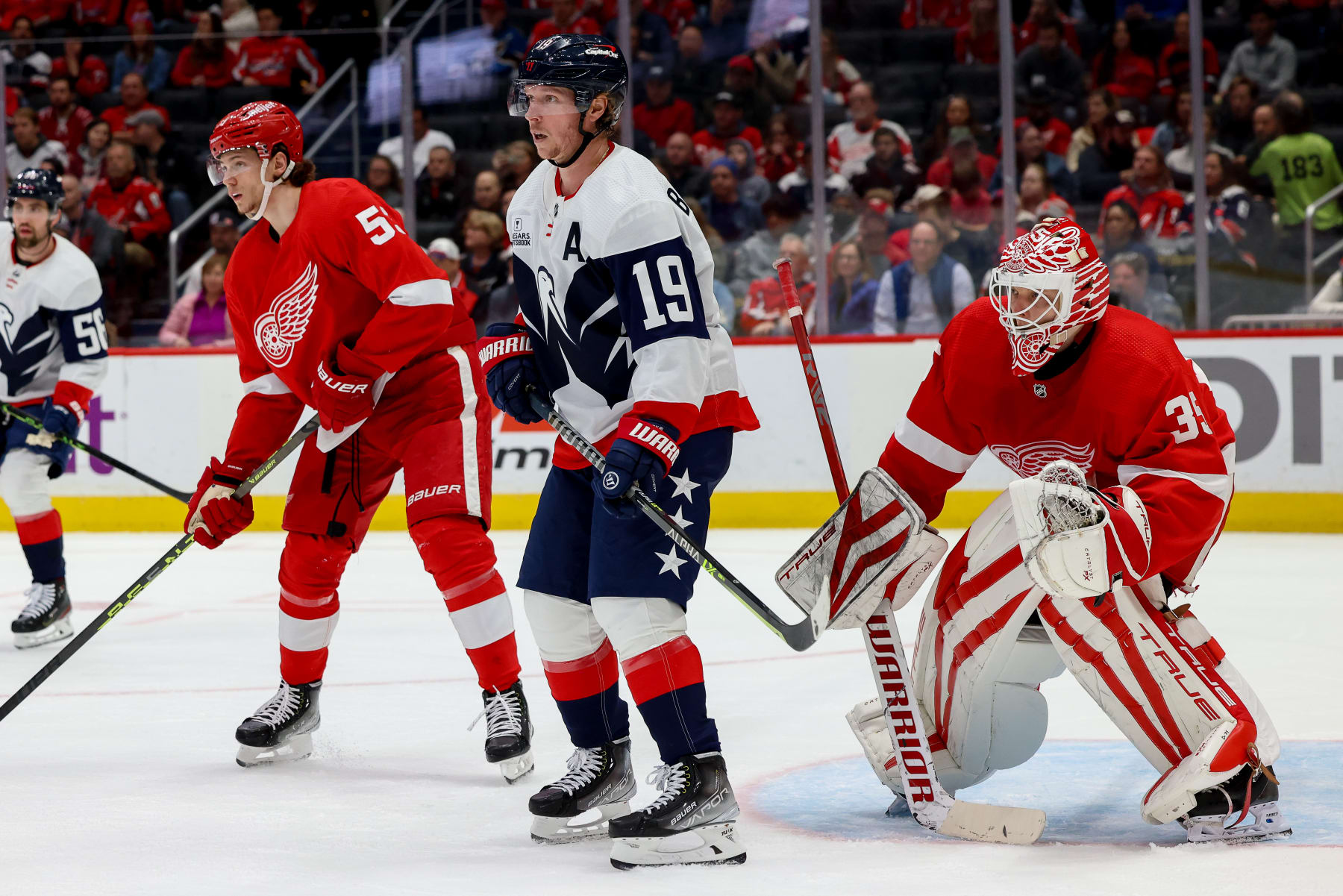 WASHINGTON, DC - FEBRUARY 21: Nicklas Backstrom #19 of the Washington Capitals creates a screen in front of Ville Husso #35 of the Detroit Red Wings during a game at Capital One Arena on February 21, 2023 in Washington, D.C. (Photo by John McCreary/NHLI via Getty Images)
