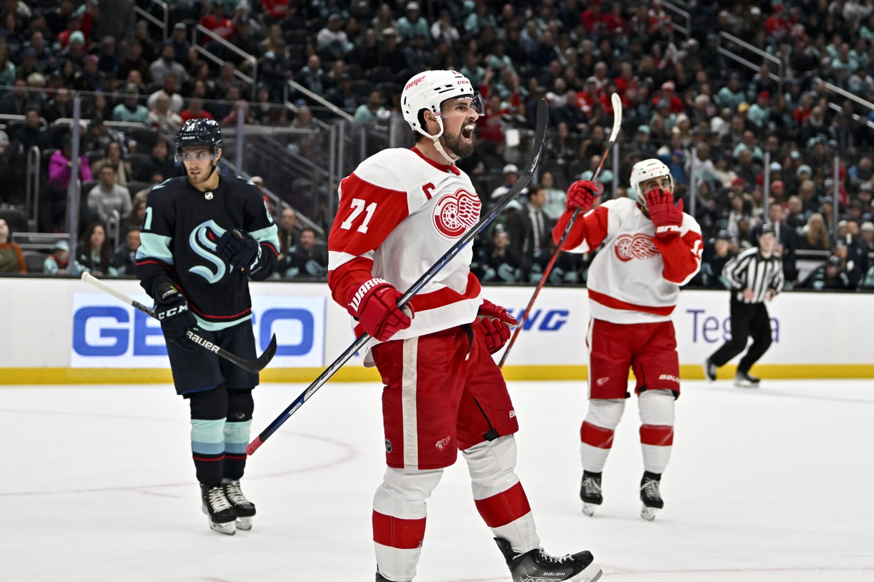 SEATTLE, WASHINGTON - FEBRUARY 18: Dylan Larkin #71 of the Detroit Red Wings celebrates after scoring during the third period against the Seattle Kraken at Climate Pledge Arena on February 18, 2023 in Seattle, Washington. The Seattle Kraken won 4-2. (Photo by Alika Jenner/Getty Images)