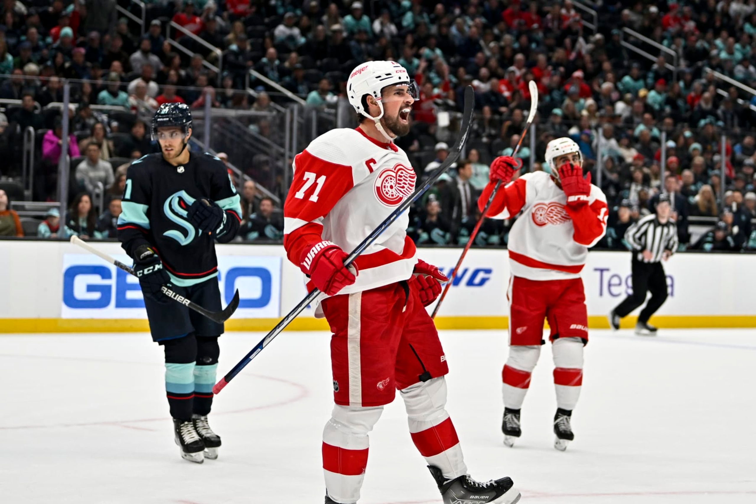 SEATTLE, WASHINGTON - FEBRUARY 18: Dylan Larkin #71 of the Detroit Red Wings celebrates after scoring during the third period against the Seattle Kraken at Climate Pledge Arena on February 18, 2023 in Seattle, Washington. The Seattle Kraken won 4-2. (Photo by Alika Jenner/Getty Images)