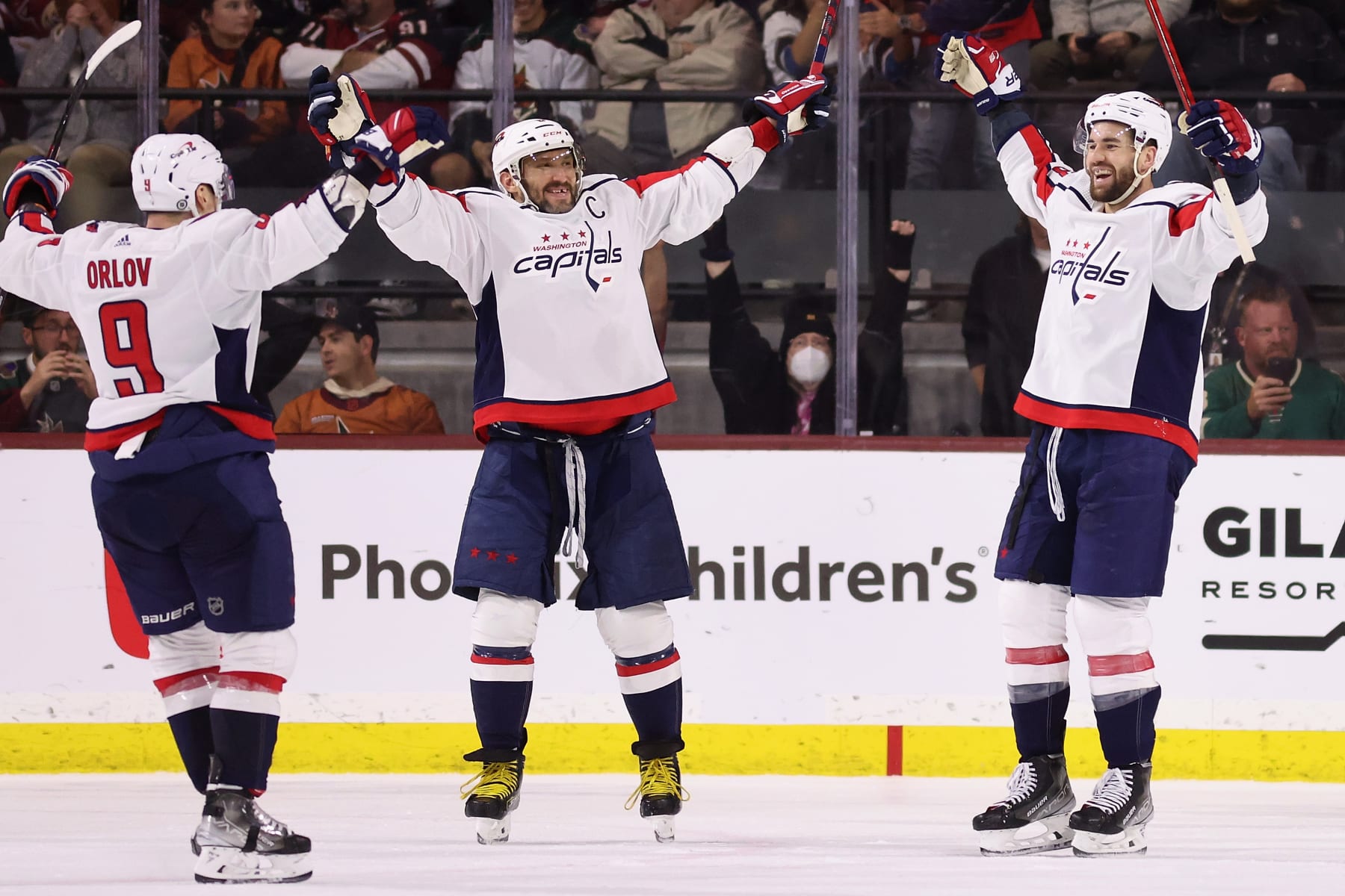 TEMPE, ARIZONA - JANUARY 19: (L-R) Dmitry Orlov #9, Alex Ovechkin #8 and Tom Wilson #43 of the Washington Capitals celebrate after Wilson scored a power-play goal against the Arizona Coyotes during the second period of the NHL game at Mullett Arena on January 19, 2023 in Tempe, Arizona. (Photo by Christian Petersen/Getty Images)