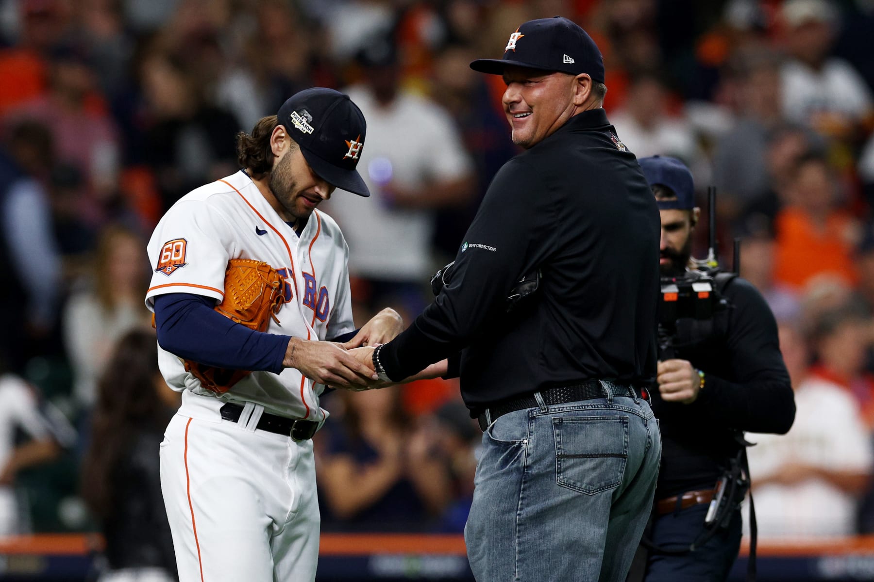 HOUSTON, TEXAS - OCTOBER 19: Lance McCullers Jr. #43 of the Houston Astros jokingly inspects like an umpire former Houston Astros pitcher Roger Clemens after the first pitch before the game against the New York Yankees in game one of the American League Championship Series at Minute Maid Park on October 19, 2022 in Houston, Texas. (Photo by Tom Pennington/Getty Images)