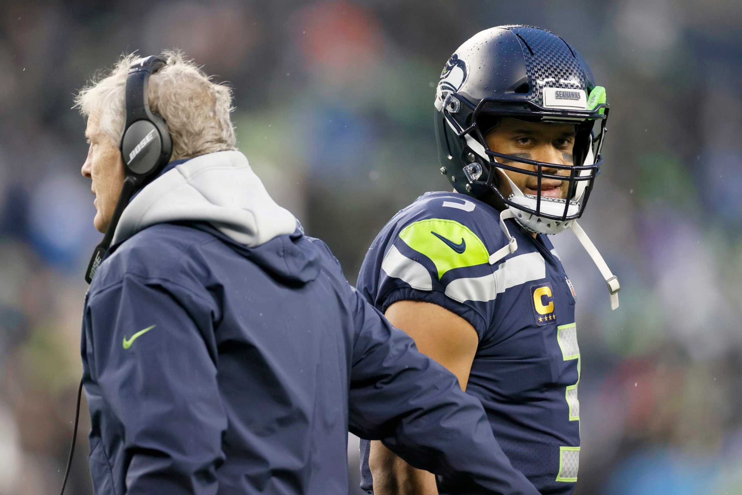 SEATTLE, WASHINGTON - JANUARY 02: Head coach Pete Carroll and Russell Wilson #3 of the Seattle Seahawks interact on the sidelines during the second half against the Detroit Lions at Lumen Field on January 02, 2022 in Seattle, Washington. (Photo by Steph Chambers/Getty Images) SEATTLE, WASHINGTON - JANUARY 02: Head coach Pete Carroll and Russell Wilson #3 of the Seattle Seahawks interact on the sidelines during the second half against the Detroit Lions at Lumen Field on January 02, 2022 in Seattle, Washington. (Photo by Steph Chambers/Getty Images)