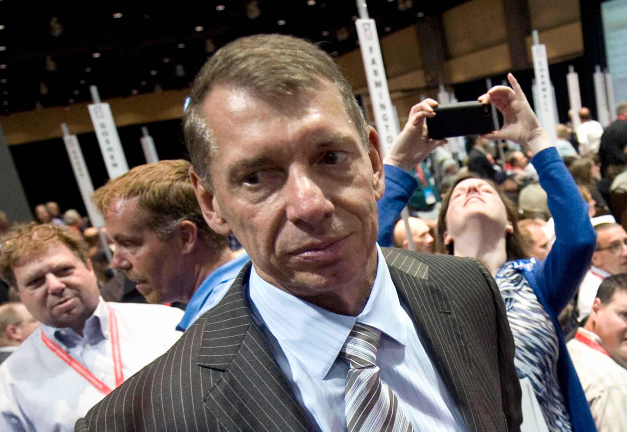 FILE - Vince McMahon stands at Republican state convention in Hartford, Conn., Friday, May 18, 2012. McMahon is voluntarily stepping back from his roles as CEO and chairman at WWE, Friday, June 17, 2022, as the sports entertainment company performs an investigation into alleged misconduct related to a relationship with a former employee. (AP Photo/Jessica Hill, File) FILE - Vince McMahon stands at Republican state convention in Hartford, Conn., Friday, May 18, 2012. McMahon is voluntarily stepping back from his roles as CEO and chairman at WWE, Friday, June 17, 2022, as the sports entertainment company performs an investigation into alleged misconduct related to a relationship with a former employee. (AP Photo/Jessica Hill, File)