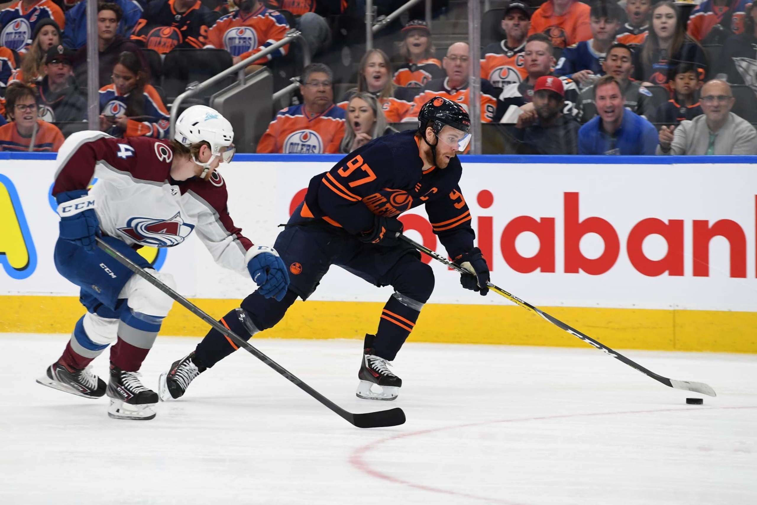 EDMONTON, ALBERTA - JUNE 06: Connor McDavid #97 of the Edmonton Oilers carries the puck in front of Bowen Byram #4 of the Colorado Avalanche during the second period in Game Four of the Western Conference Final of the 2022 Stanley Cup Playoffs at Rogers Place on June 06, 2022 in Edmonton, Alberta. (Photo by Derek Leung/Getty Images) EDMONTON, ALBERTA - JUNE 06: Connor McDavid #97 of the Edmonton Oilers carries the puck in front of Bowen Byram #4 of the Colorado Avalanche during the second period in Game Four of the Western Conference Final of the 2022 Stanley Cup Playoffs at Rogers Place on June 06, 2022 in Edmonton, Alberta. (Photo by Derek Leung/Getty Images)