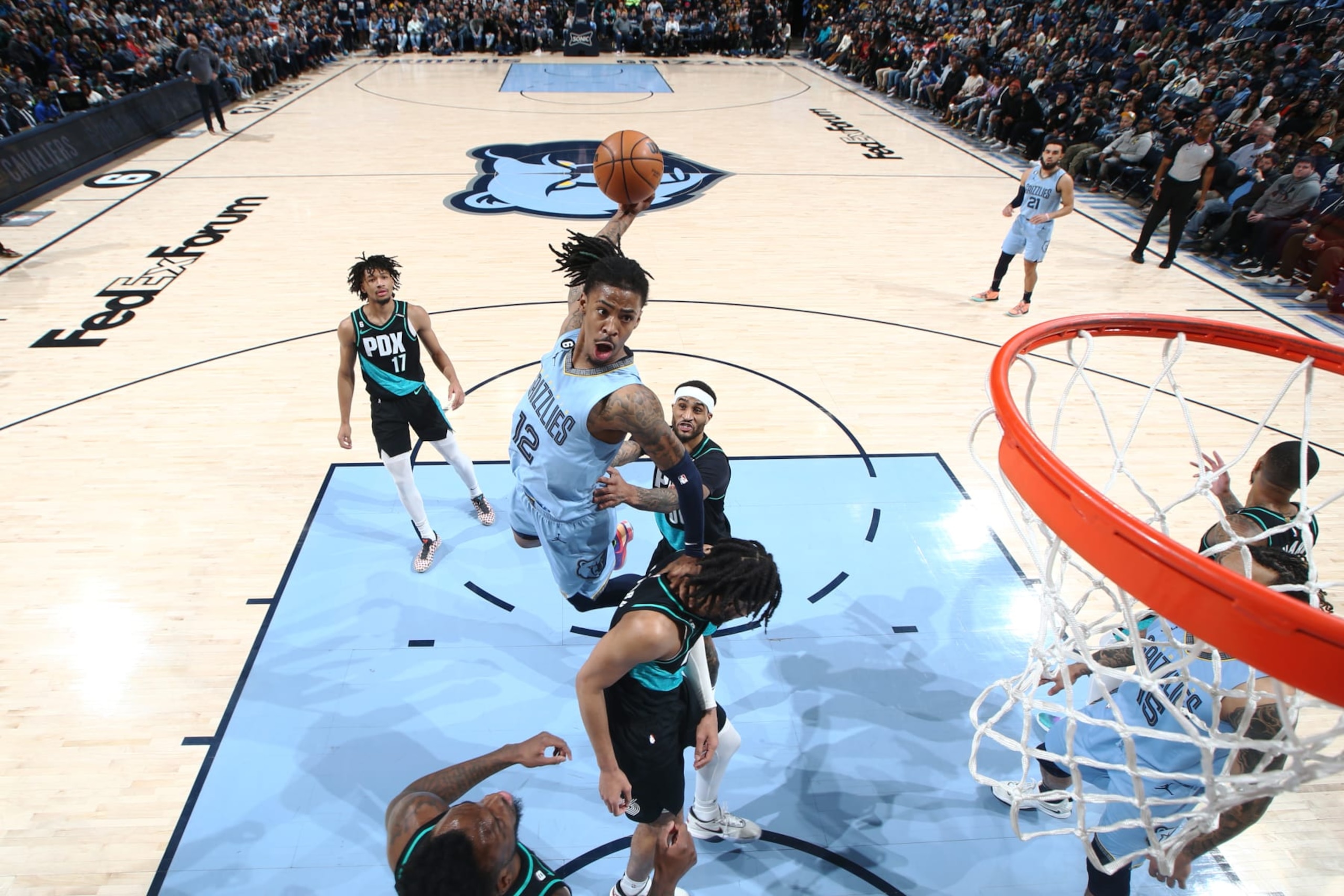 MEMPHIS, TN - FEBRUARY 1: Ja Morant #12 of the Memphis Grizzlies dunks the ball during the game against the Portland Trail Blazers on February 1, 2023 at FedExForum in Memphis, Tennessee. NOTE TO USER: User expressly acknowledges and agrees that, by downloading and or using this photograph, User is consenting to the terms and conditions of the Getty Images License Agreement. Mandatory Copyright Notice: Copyright 2022 NBAE (Photo by Joe Murphy/NBAE via Getty Images) MEMPHIS, TN - FEBRUARY 1: Ja Morant #12 of the Memphis Grizzlies dunks the ball during the game against the Portland Trail Blazers on February 1, 2023 at FedExForum in Memphis, Tennessee. NOTE TO USER: User expressly acknowledges and agrees that, by downloading and or using this photograph, User is consenting to the terms and conditions of the Getty Images License Agreement. Mandatory Copyright Notice: Copyright 2022 NBAE (Photo by Joe Murphy/NBAE via Getty Images)