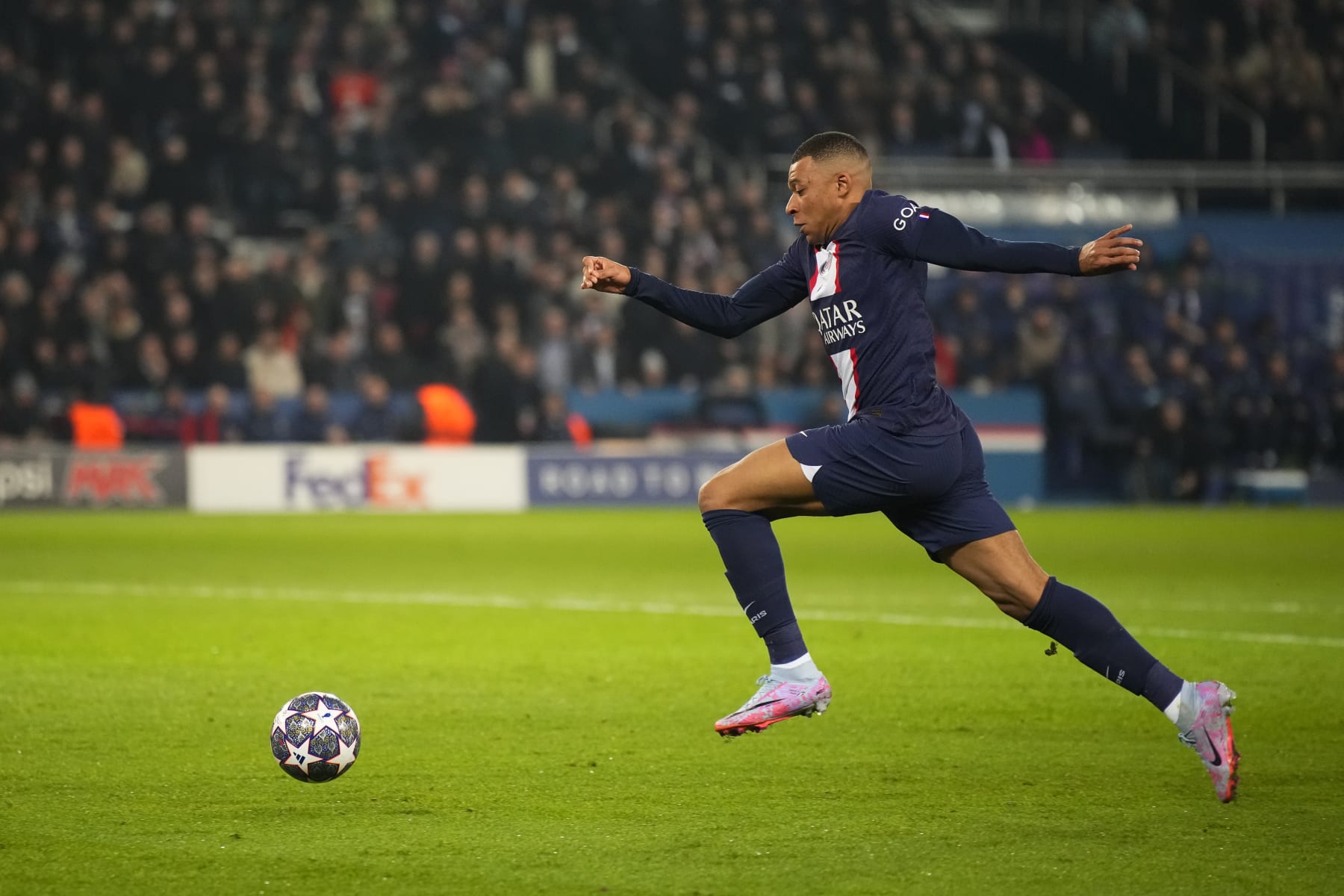 PARIS, FRANCE - FEBRUARY 14: Kylian Mbappe (7) runs the ball in the goal zone during the round of 8 Champions League match between Paris Saint-Germain (PSG) and Bayern Munich at Parc des Princes on February 14, 2023 in Paris, France. (Photo by Glenn Gervot/Icon Sportswire via Getty Images)