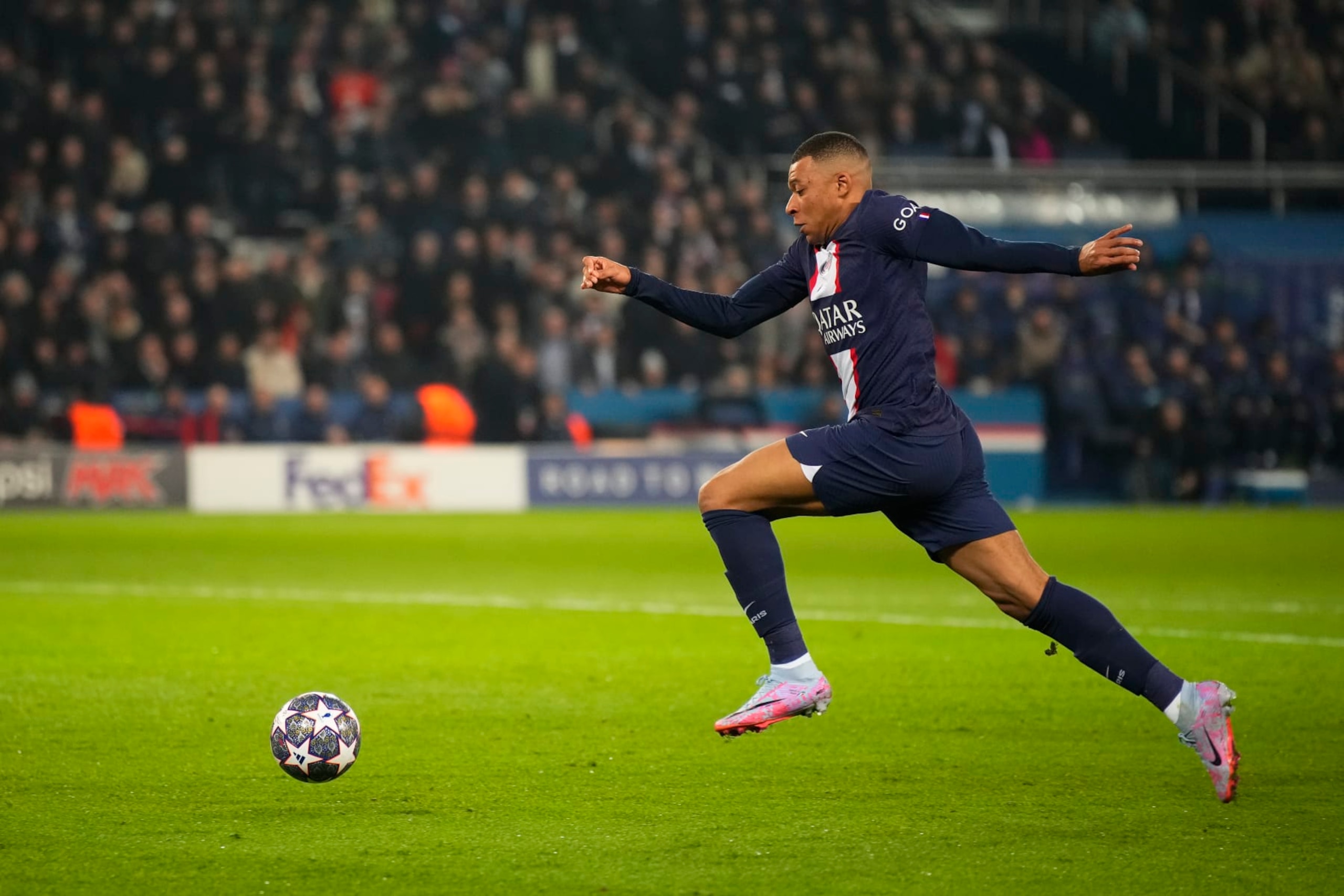 PARIS, FRANCE - FEBRUARY 14: Kylian Mbappe (7) runs the ball in the goal zone during the round of 8 Champions League match between Paris Saint-Germain (PSG) and Bayern Munich at Parc des Princes on February 14, 2023 in Paris, France. (Photo by Glenn Gervot/Icon Sportswire via Getty Images) PARIS, FRANCE - FEBRUARY 14: Kylian Mbappe (7) runs the ball in the goal zone during the round of 8 Champions League match between Paris Saint-Germain (PSG) and Bayern Munich at Parc des Princes on February 14, 2023 in Paris, France. (Photo by Glenn Gervot/Icon Sportswire via Getty Images)