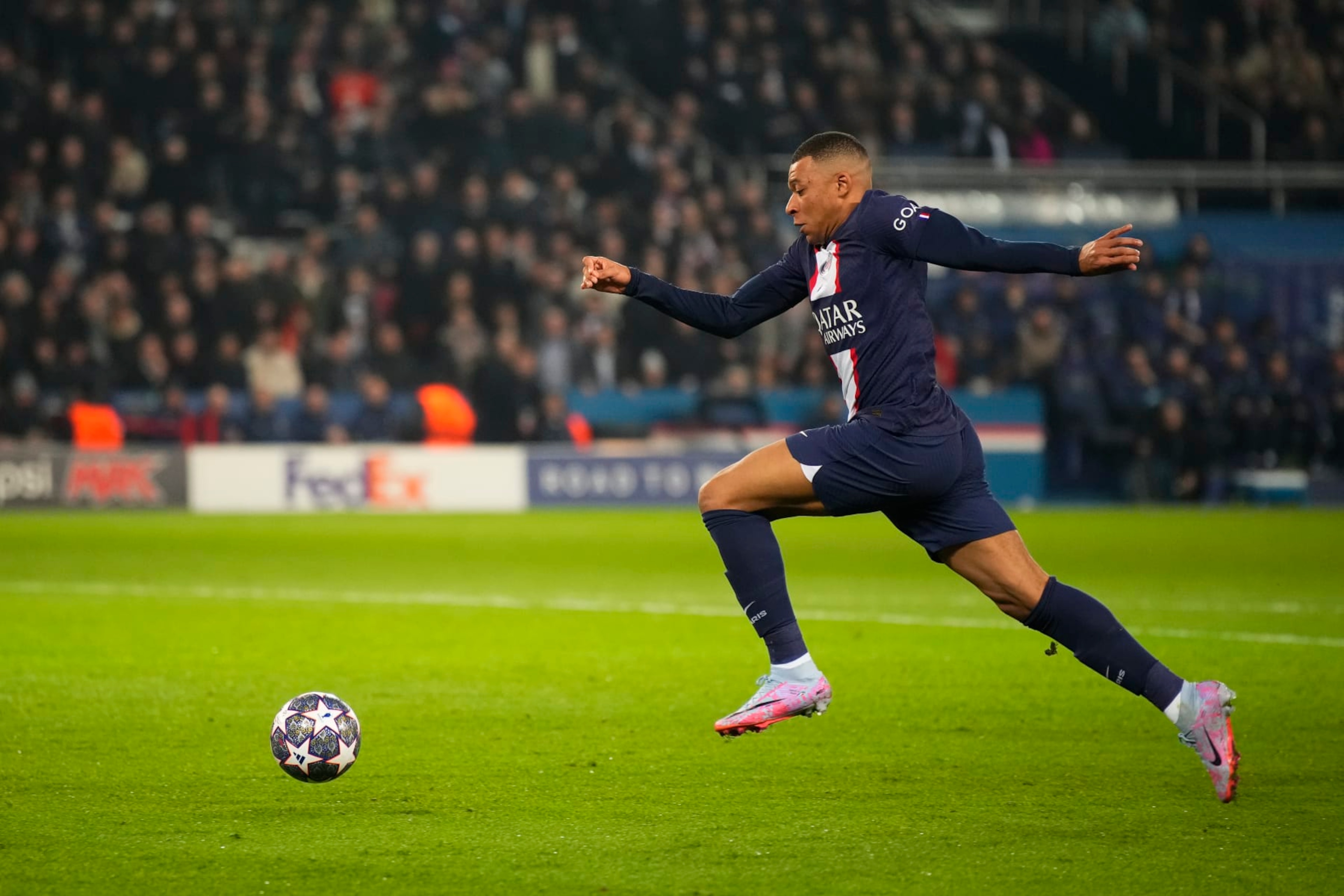 PARIS, FRANCE - FEBRUARY 14: Kylian Mbappe (7) runs the ball in the goal zone during the round of 8 Champions League match between Paris Saint-Germain (PSG) and Bayern Munich at Parc des Princes on February 14, 2023 in Paris, France. (Photo by Glenn Gervot/Icon Sportswire via Getty Images)